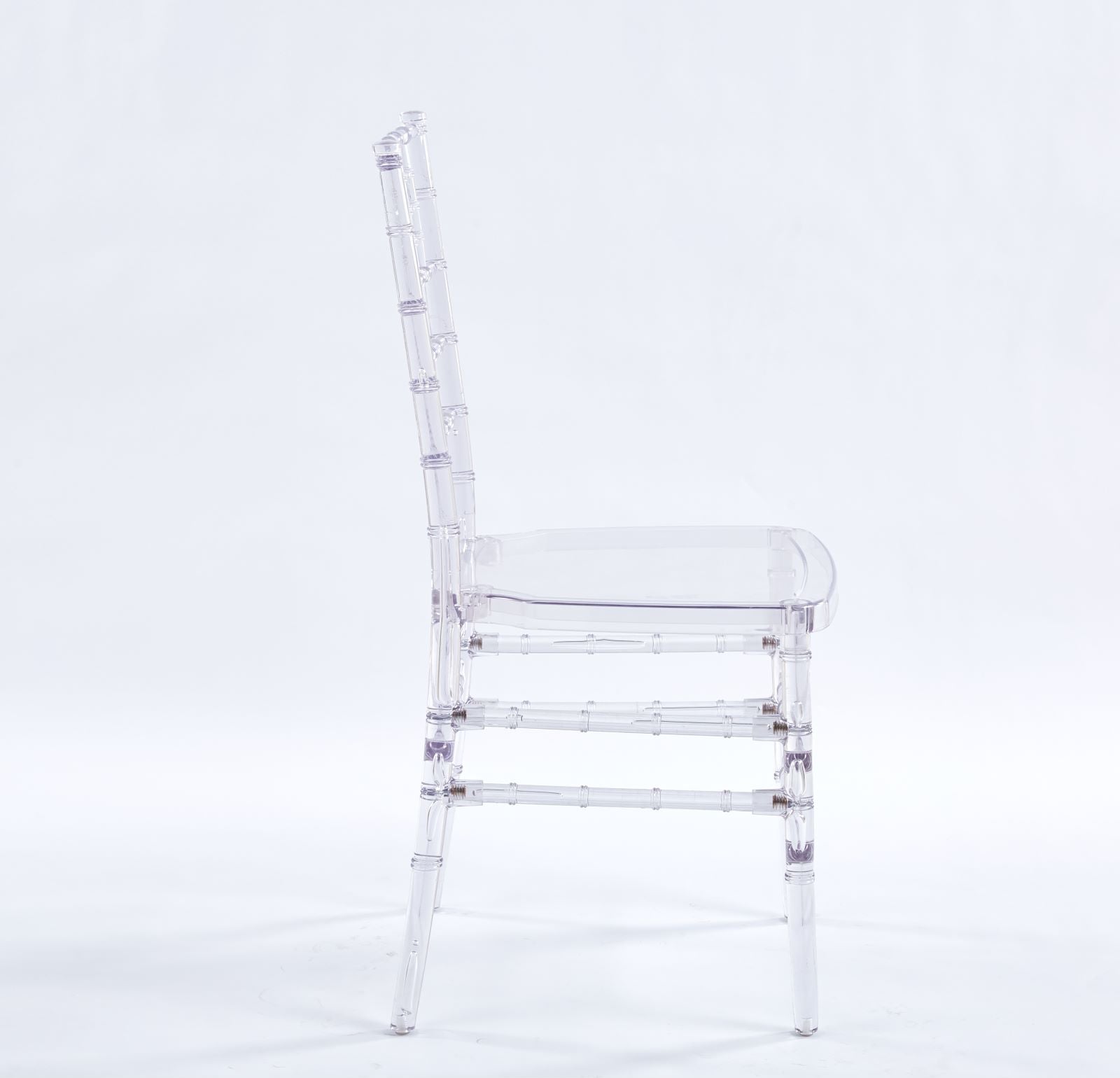 Clear acrylic ghost chair with bamboostyle detailing on legs and back