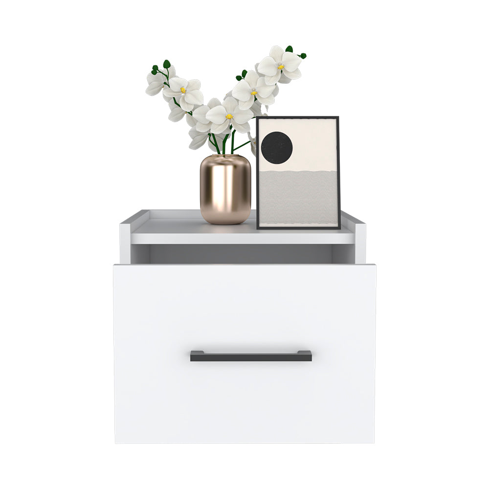 White floating nightstand with minimalist art and gold vase of white orchids