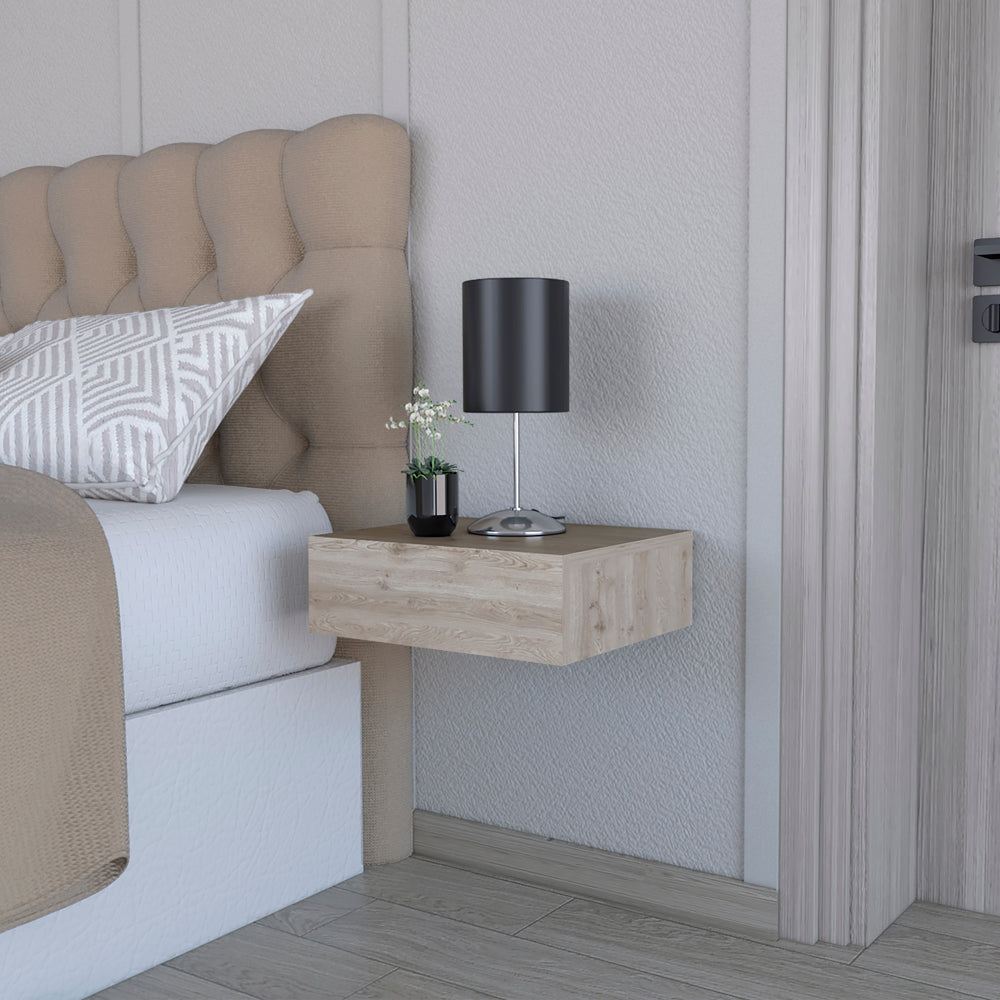 Floating bedside table with light oak finish and brushed metal lamp