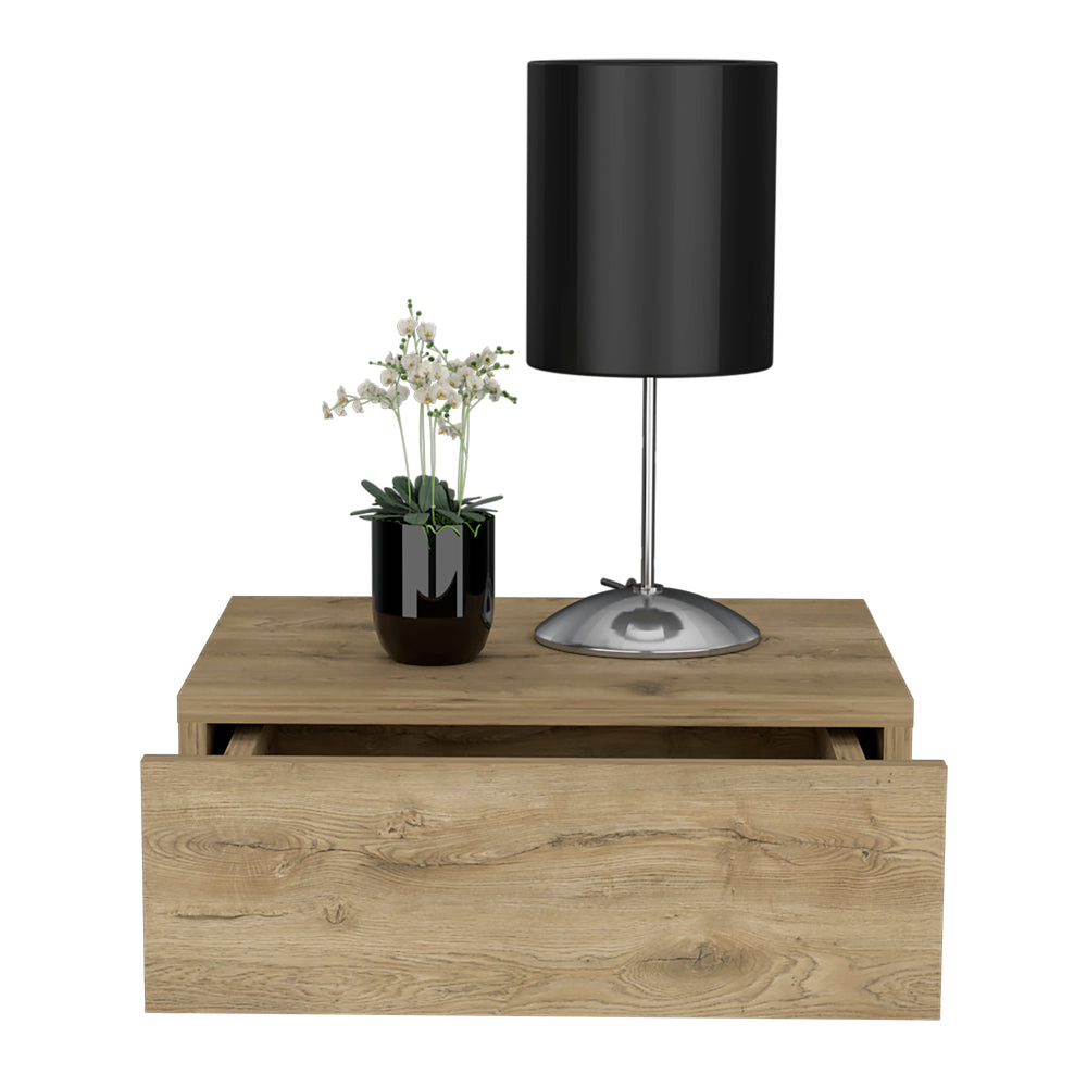 Modern oak veneer bedside table with open drawer black lamp and potted white flowers