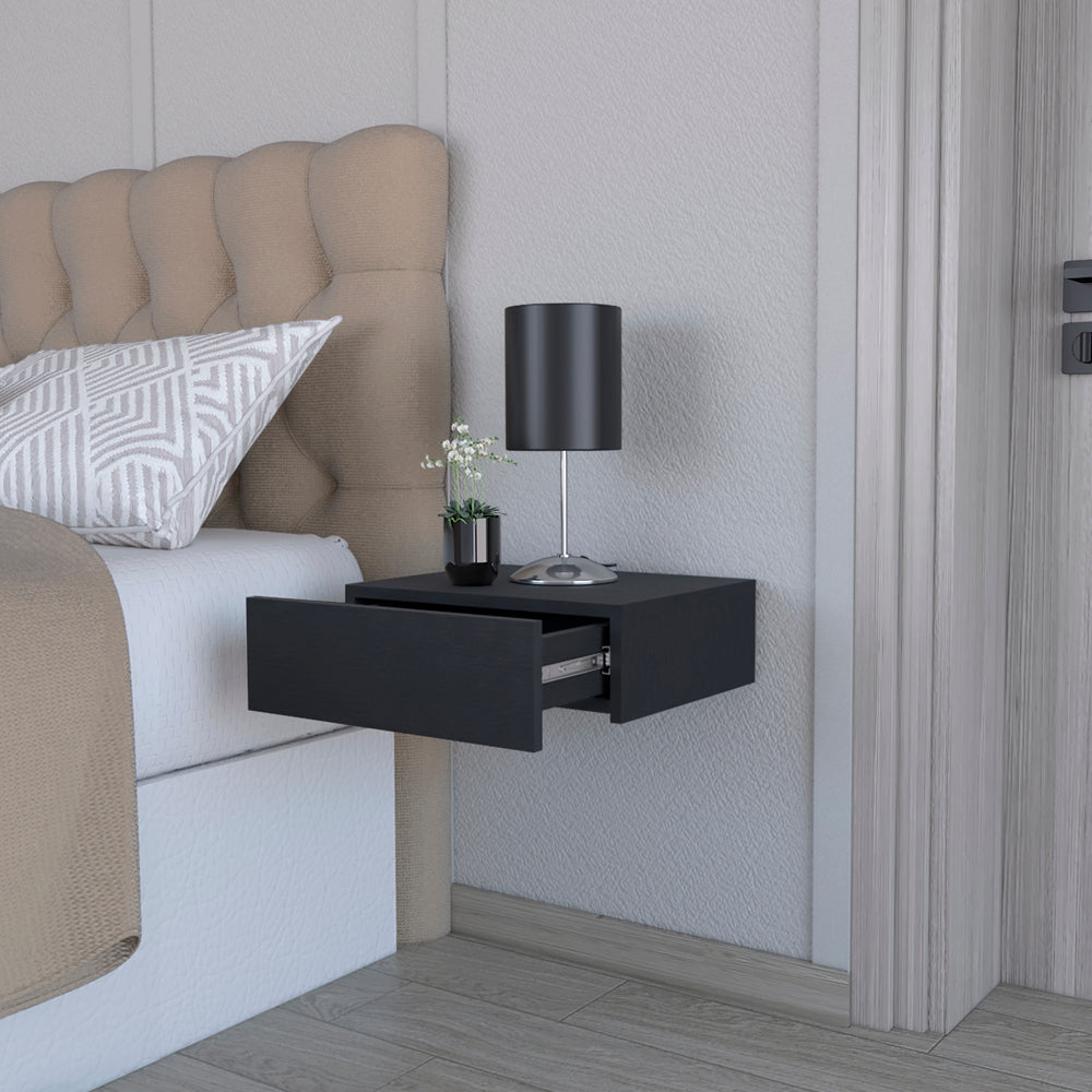 Modern black floating nightstand with open drawer and bedside lamp