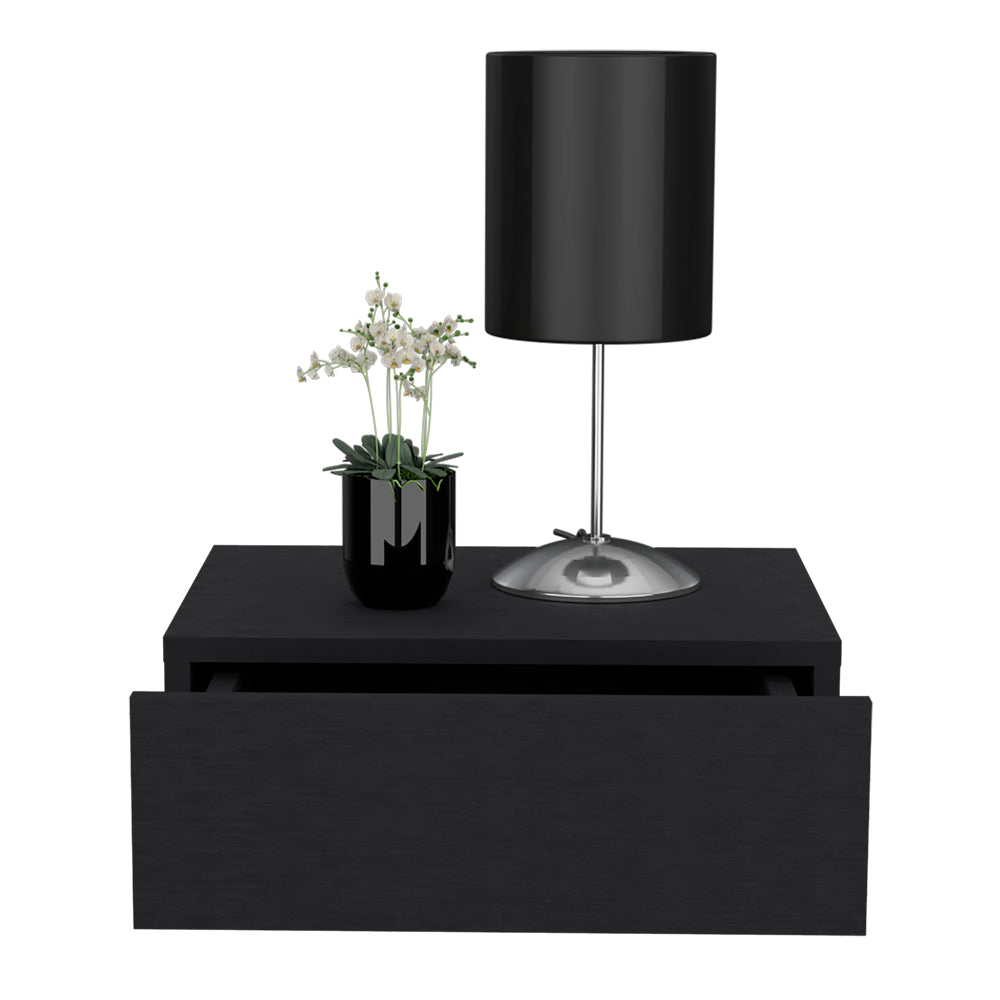 Black floating nightstand with a decorative lamp and a potted plant