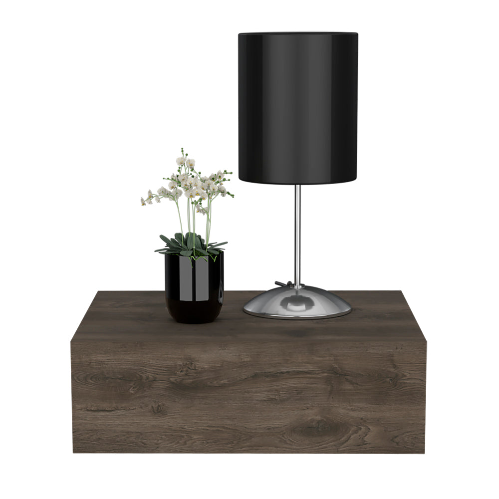 Black cylinder shade table lamp with chrome base on wood shelf