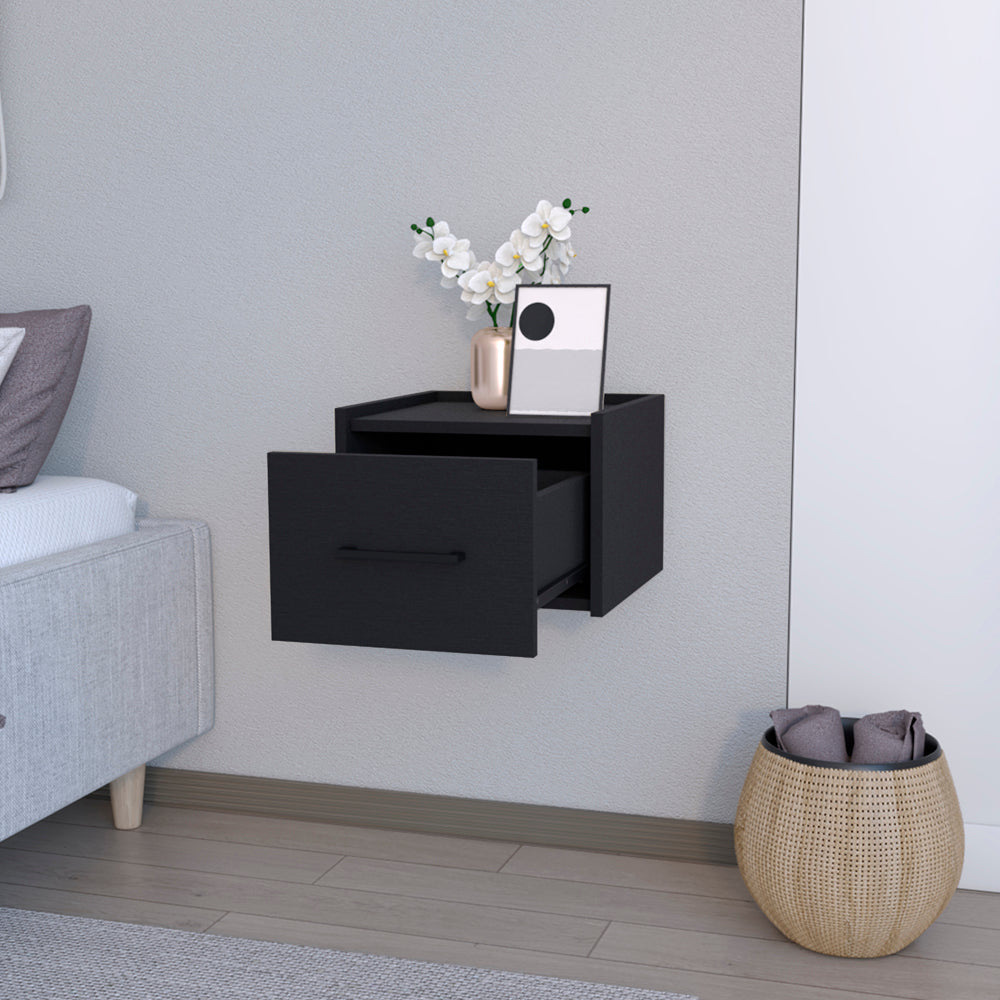 Black floating nightstand with open drawer and minimalist decor