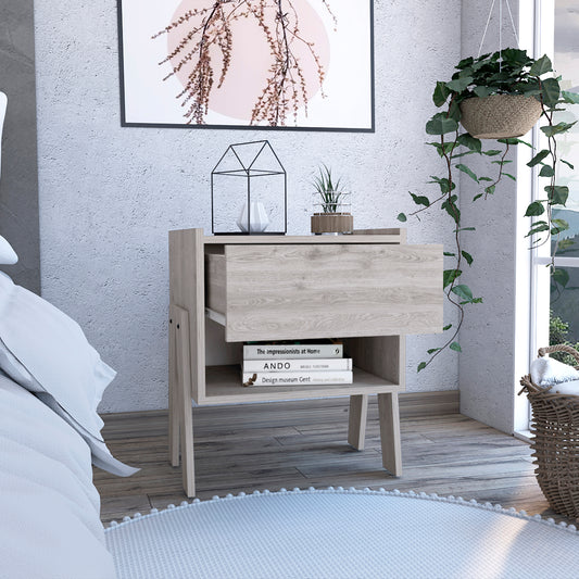 Light wood grain nightstand with one drawer and open shelf holding books