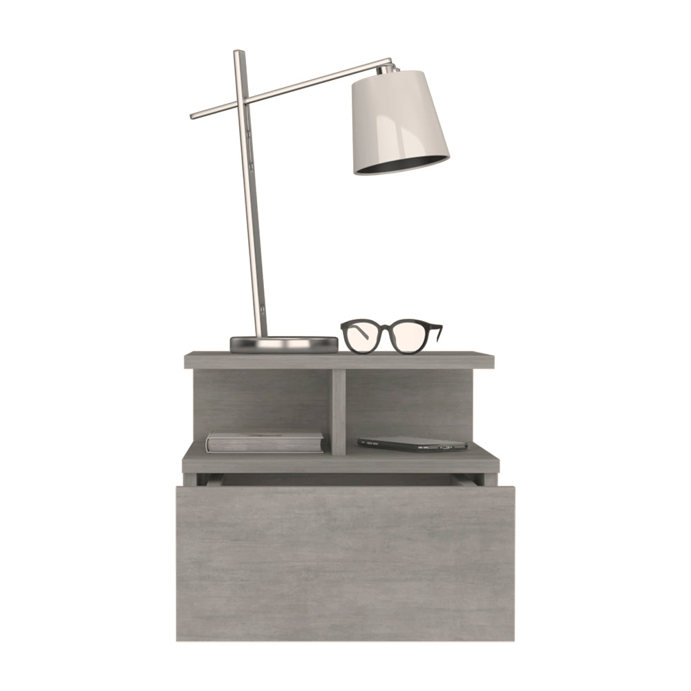 Gray modern nightstand with a slim desk lamp and blackrimmed glasses on top