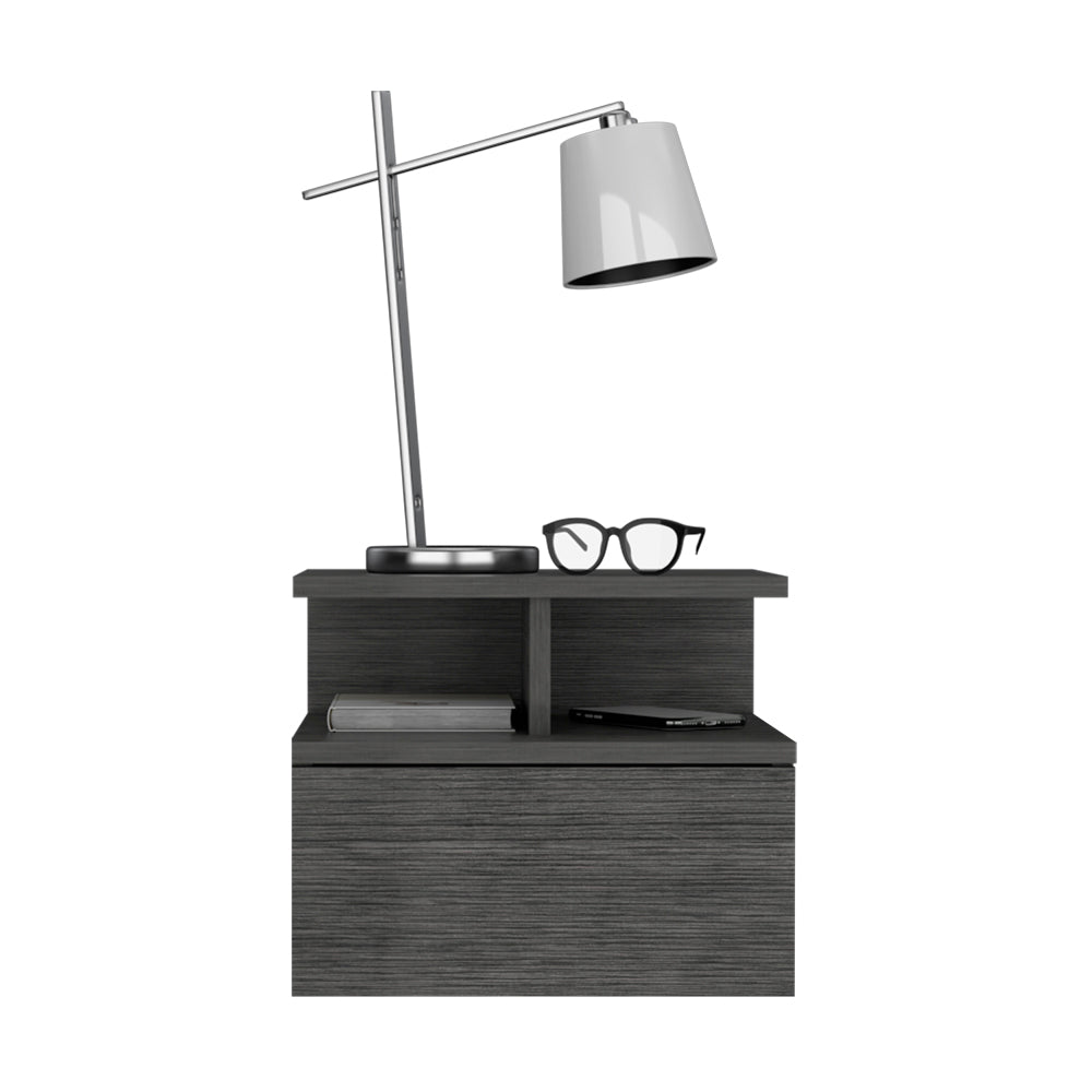 Gray modern nightstand with sleek silver lamp and blackrimmed glasses