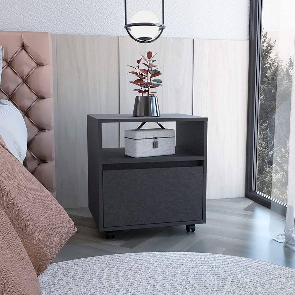 Dark gray bedside table with drawer and open shelf featuring a plant and storage case