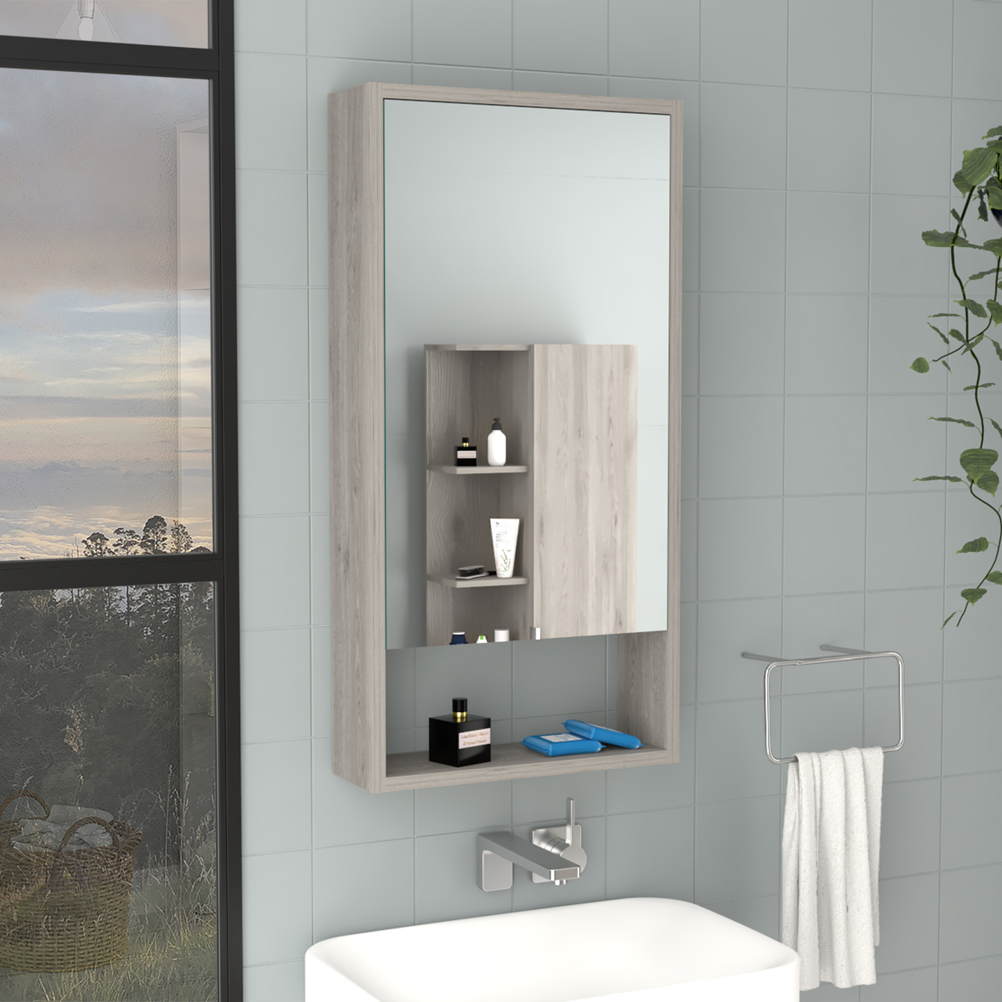 Gray wood medicine cabinet with mirrored door and open shelving displaying toiletries