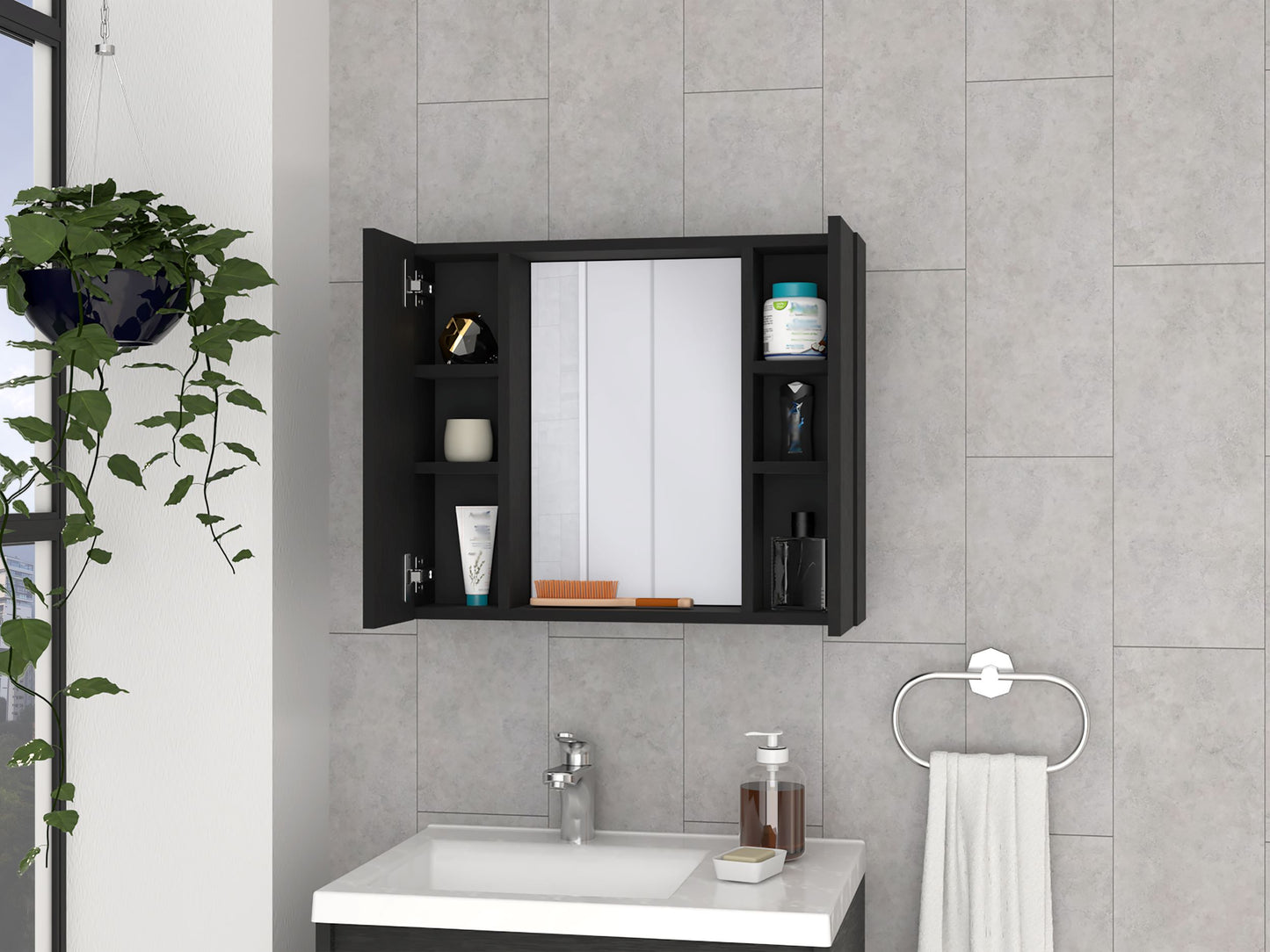 Black medicine cabinet with mirrored doors and open shelving holding toiletries