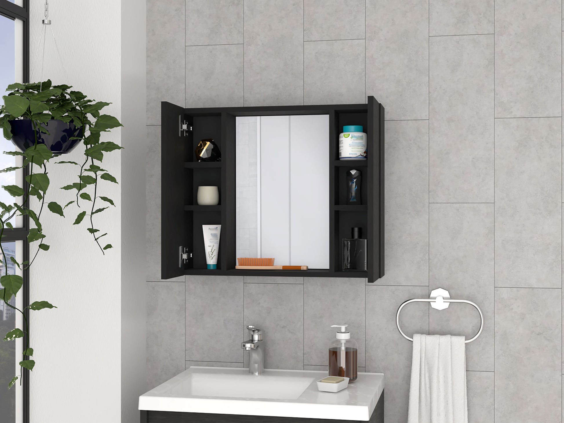 Black medicine cabinet with mirrored doors and open shelving holding toiletries