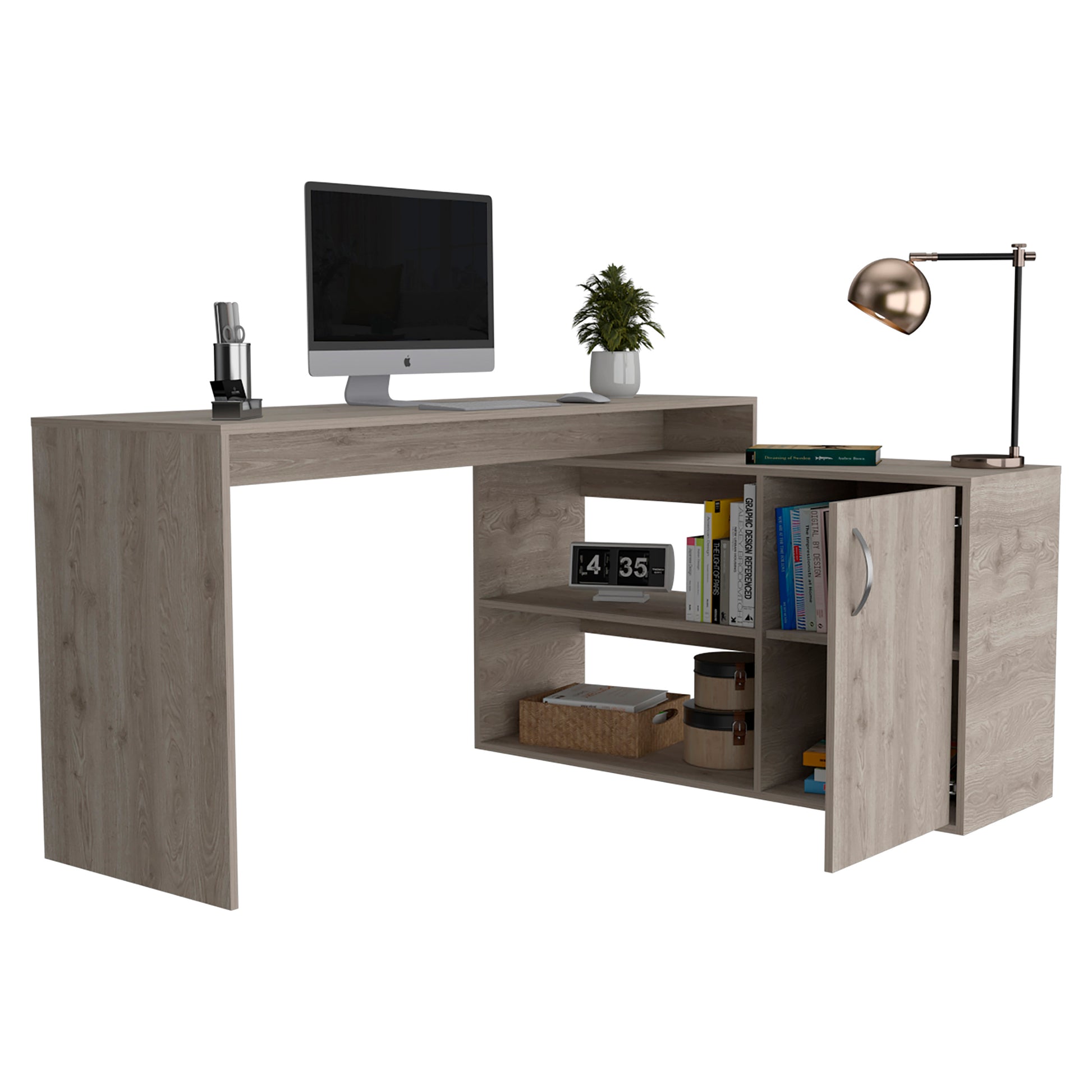 Grey wood Lshaped desk with computer plant and a rose gold desk lamp