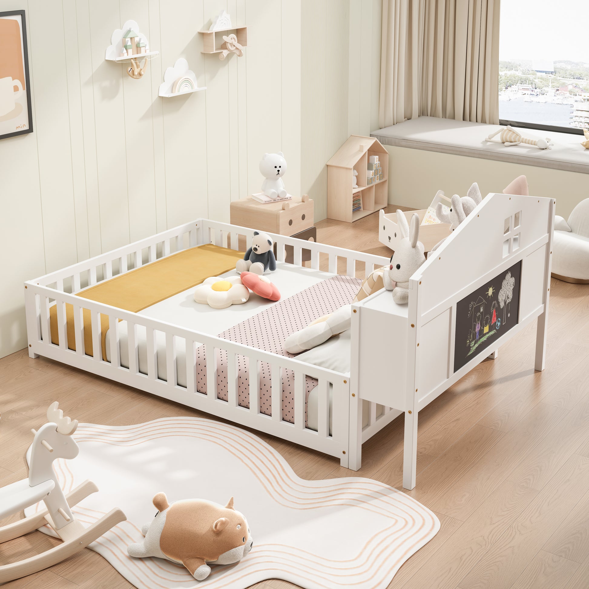White wooden toddler bed with side rails and chalk art board