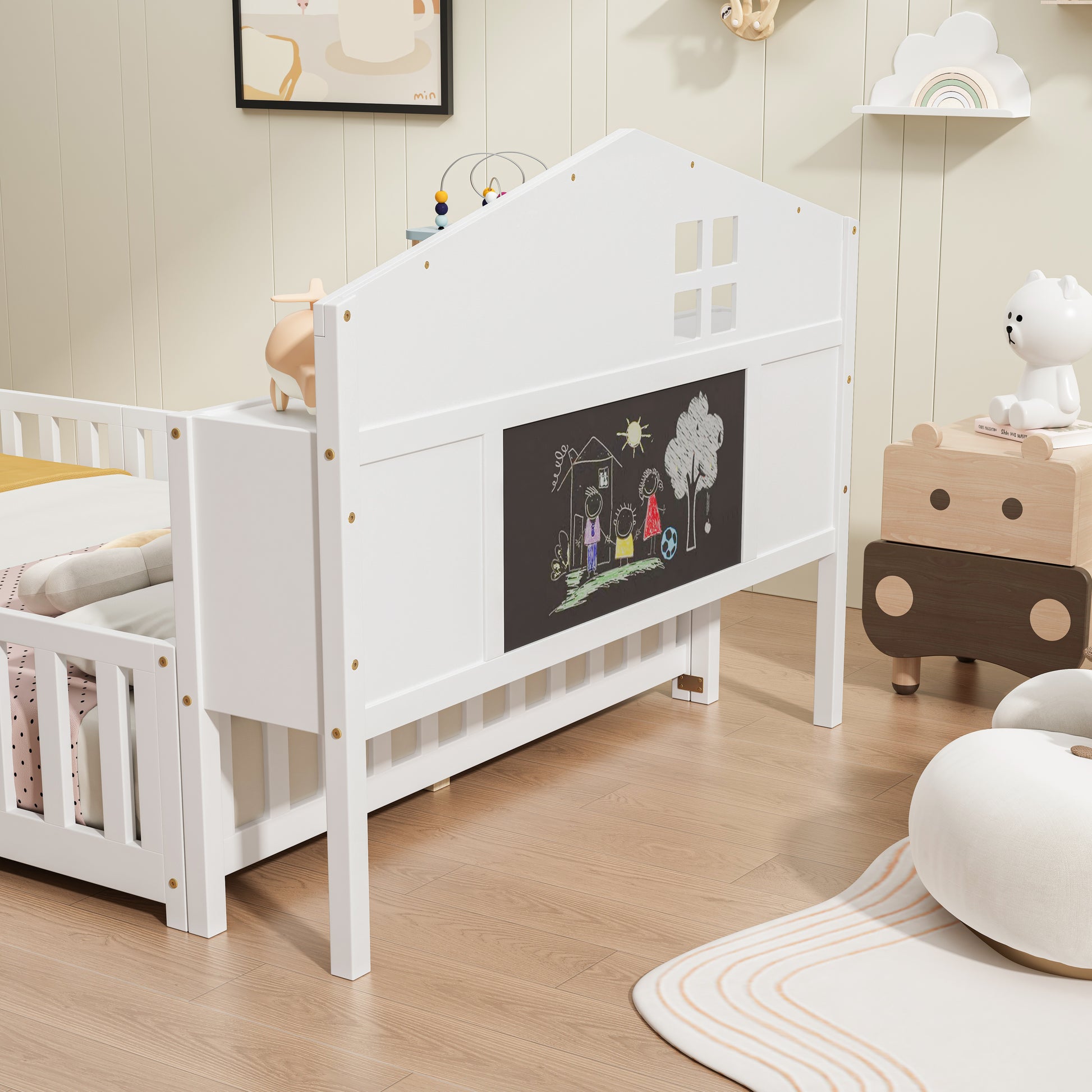 White wooden toddler bed with houseshaped headboard and chalkboard panel