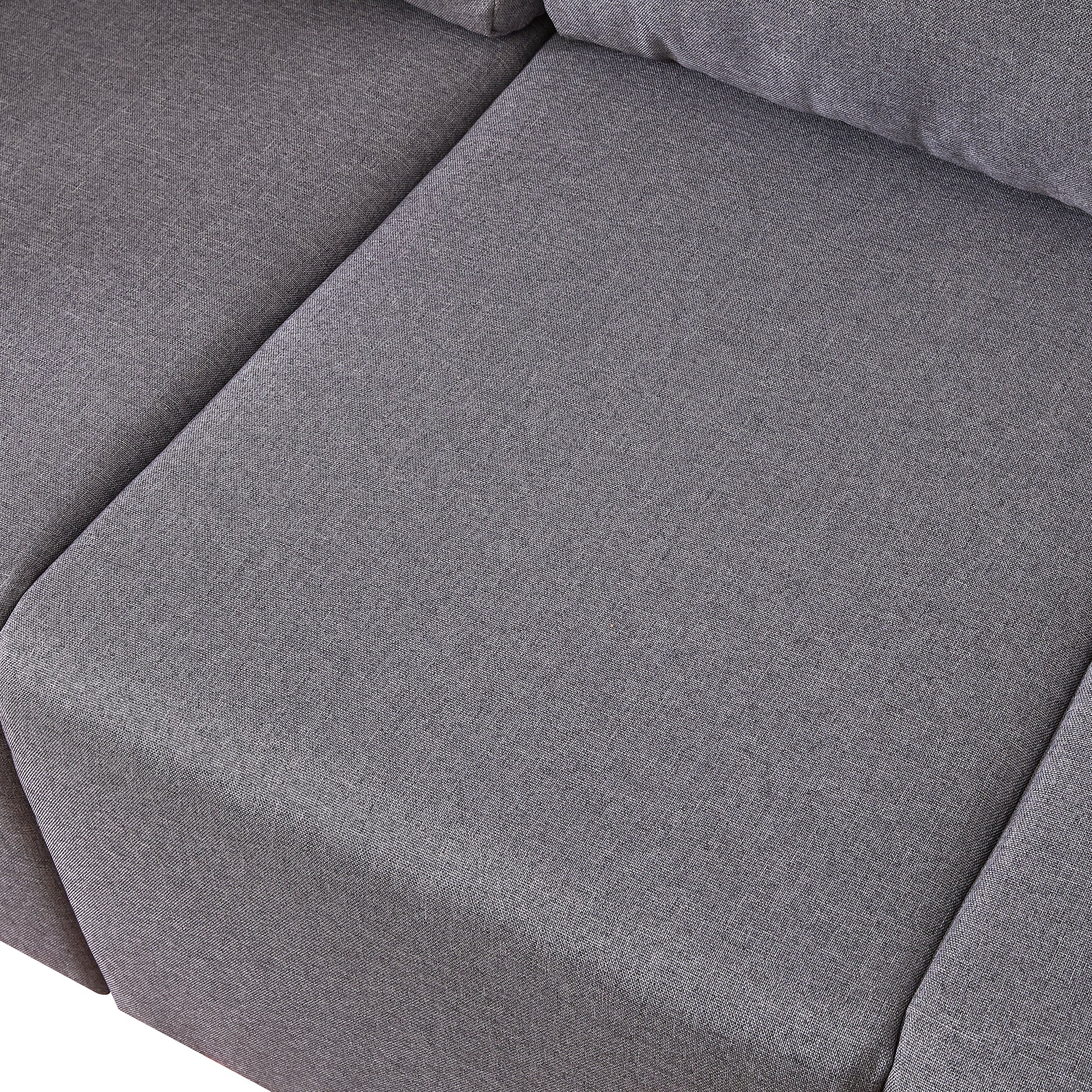 Closeup of textured grey fabric on a modern sofa cushion