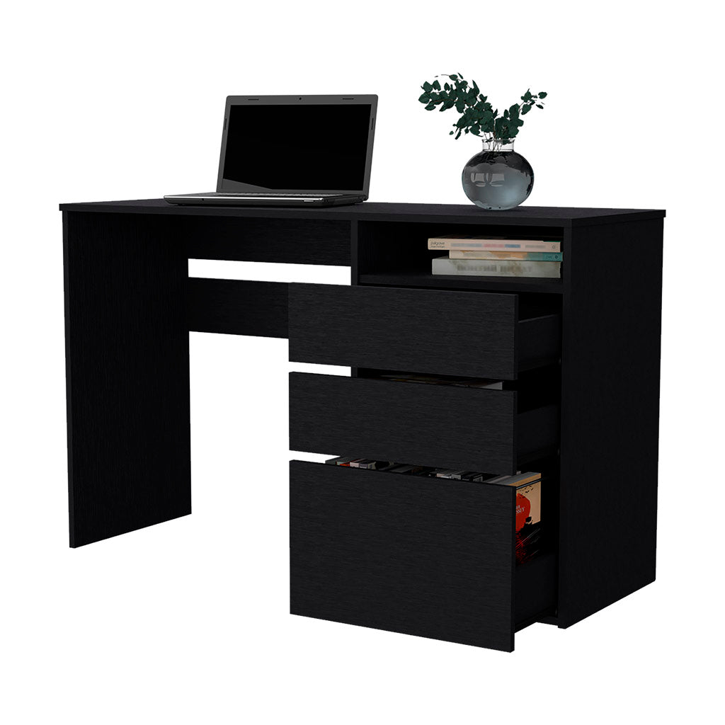 Black modern desk with laptop books and vase of greenery