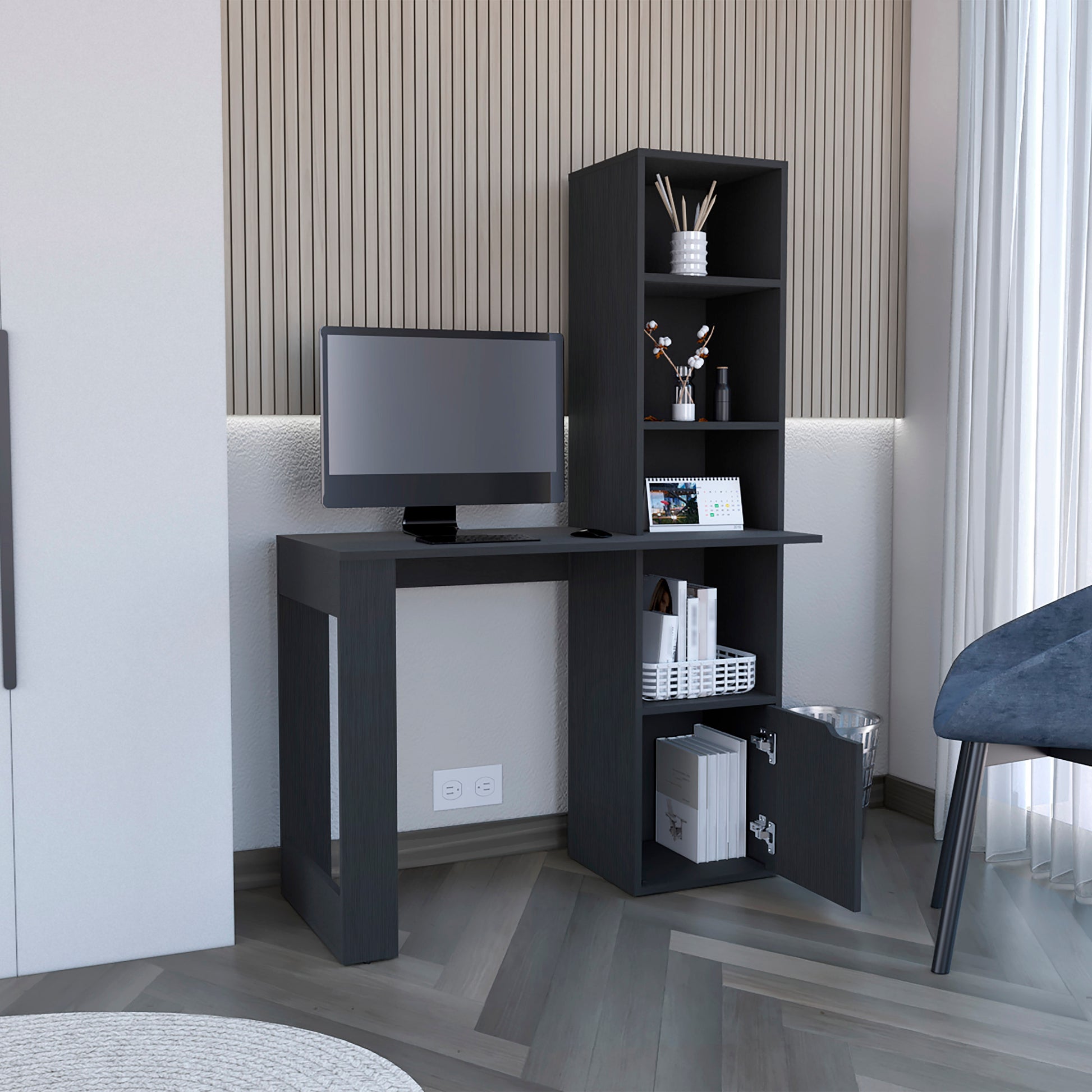 Dark gray modern computer desk with attached bookshelf and open cabinet door