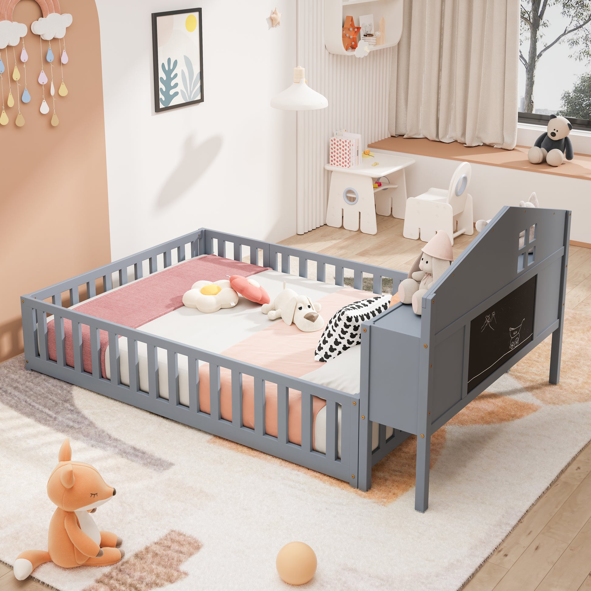 Grey wooden toddler bed with safety rails and chalkboard panel