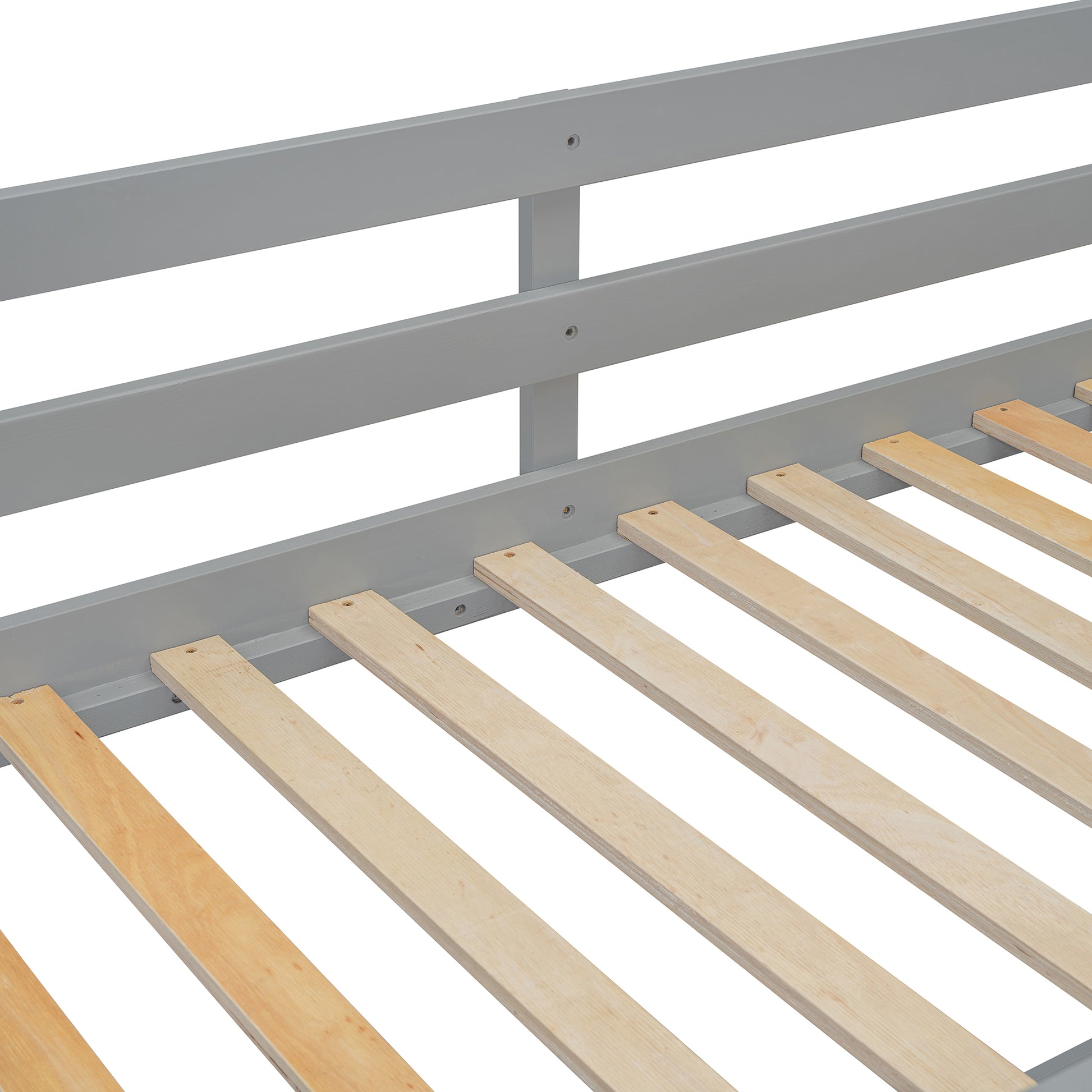 Closeup of gray wooden bed frame slats and wooden mattress supports