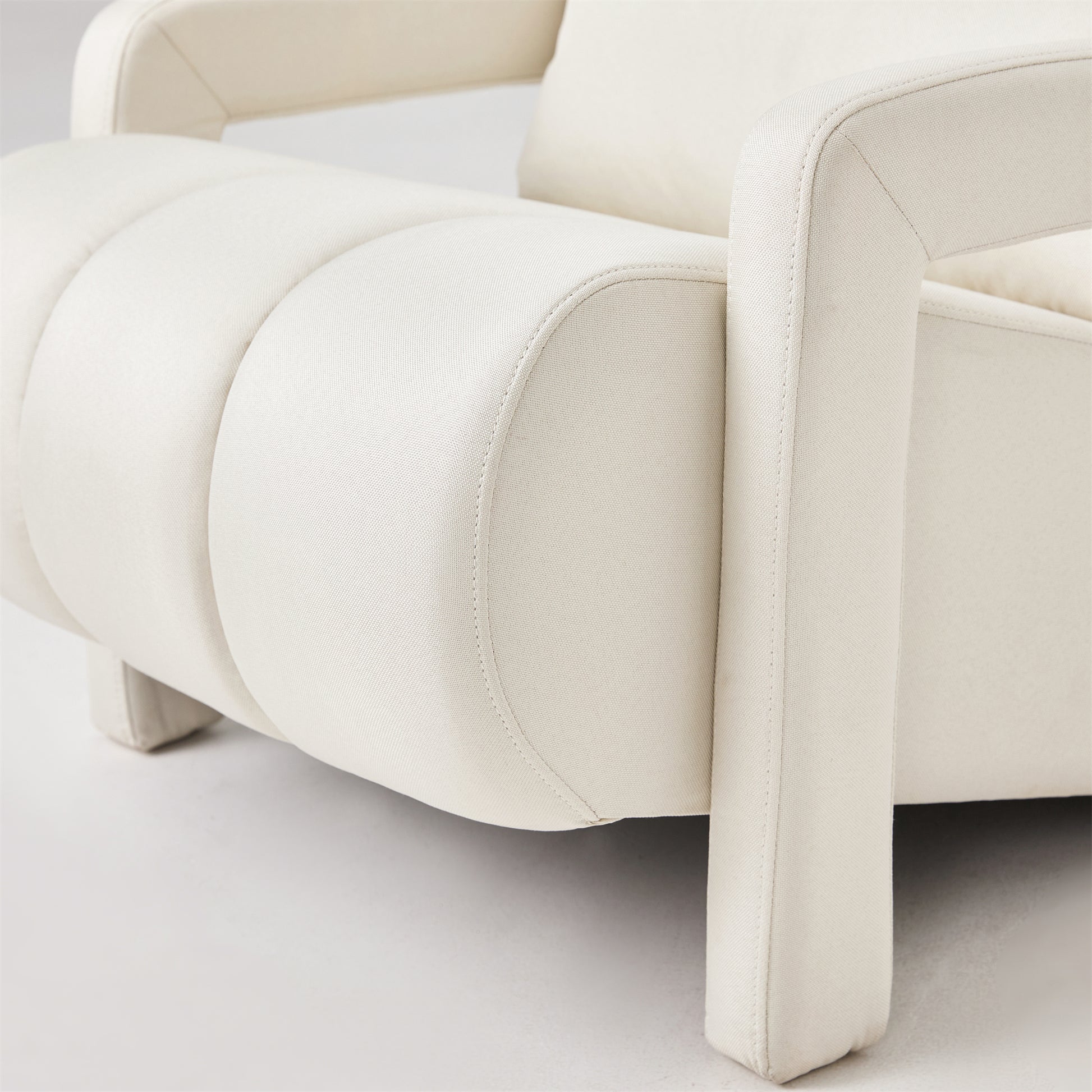 Cream boucle armchair with channel tufted seat and armrests