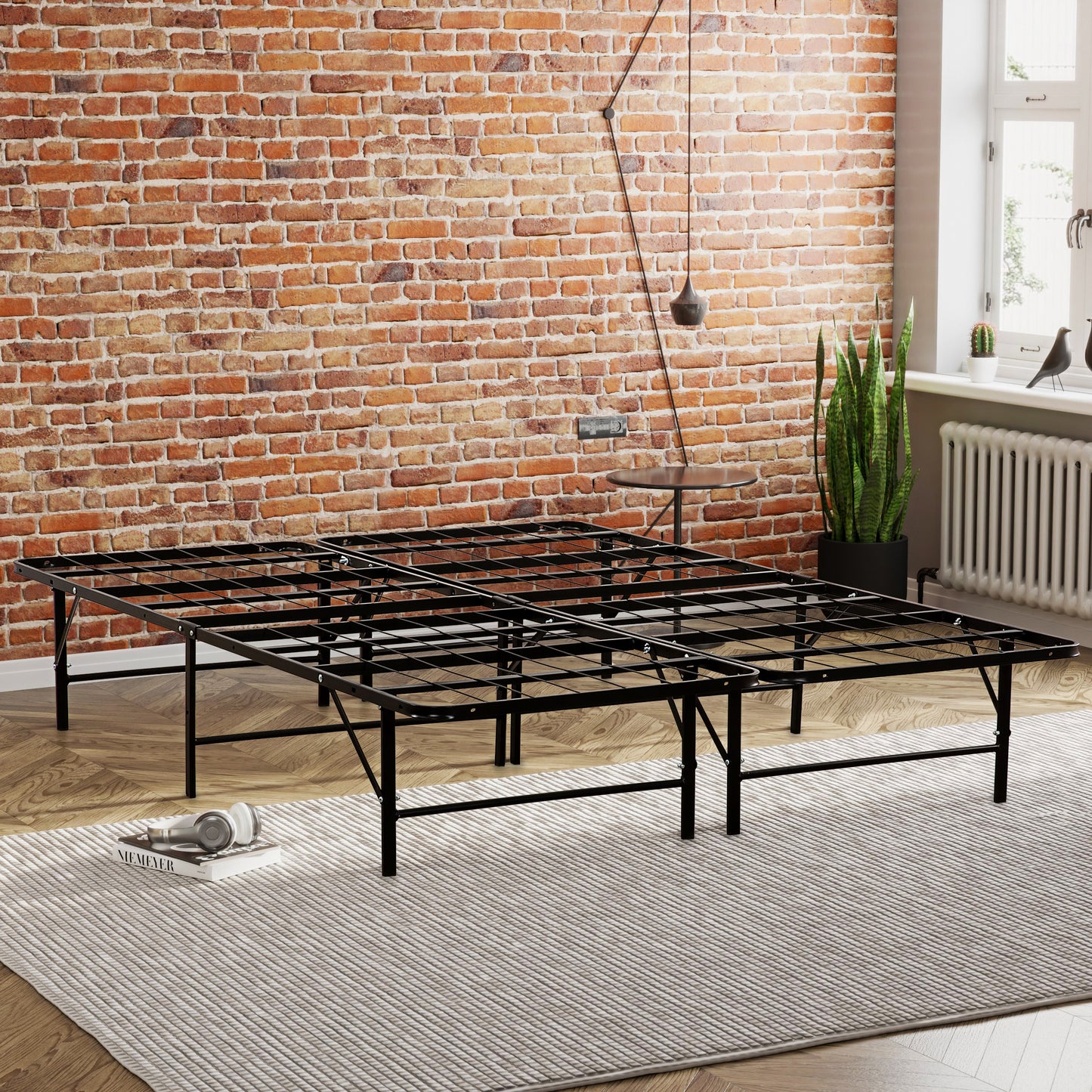 Black metal platform bed frame with a foldable design for easy storage