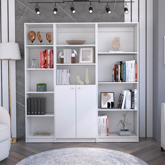 Modern white modular bookshelf with decorative brass face sculptures on top shelf