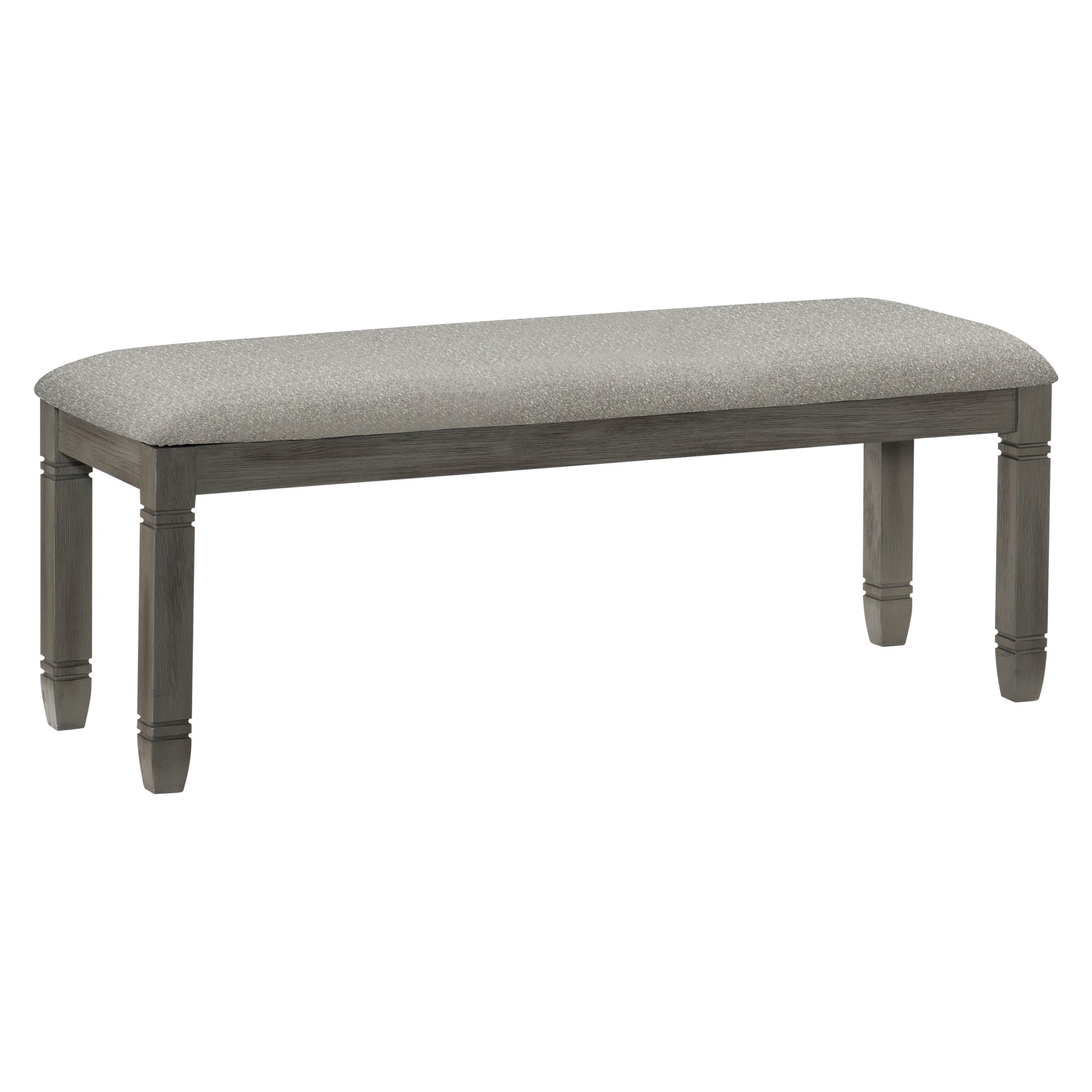 Gray upholstered dining bench with carved wooden legs and a neutral fabric seat