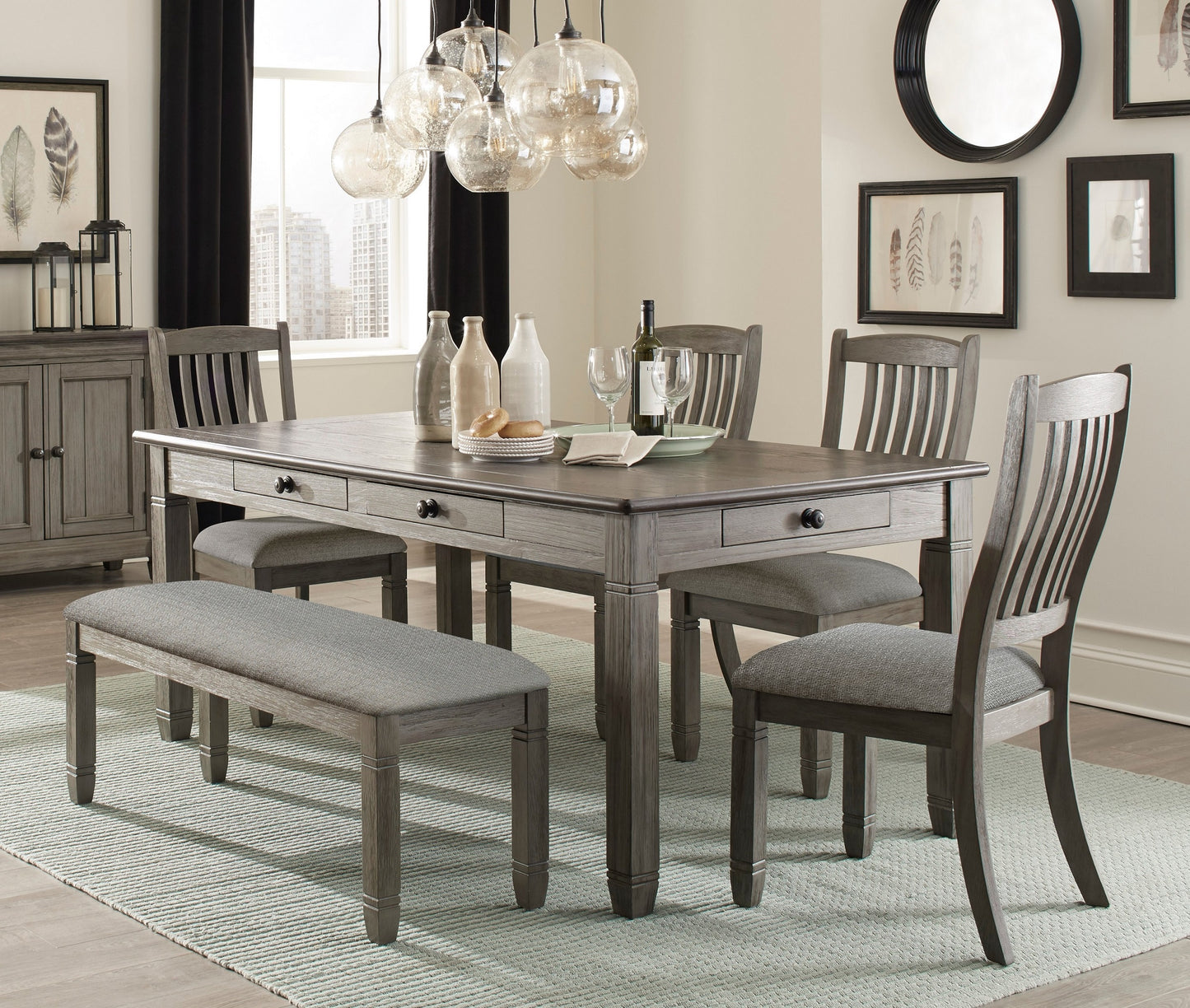 Gray wash wood dining table with upholstered bench