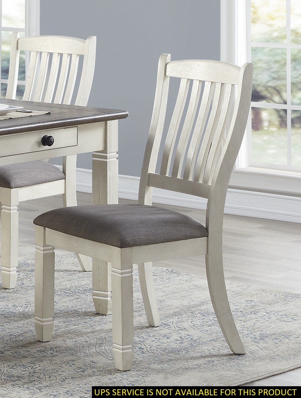 White farmhouse dining chair with upholstered grey seat and slatted back