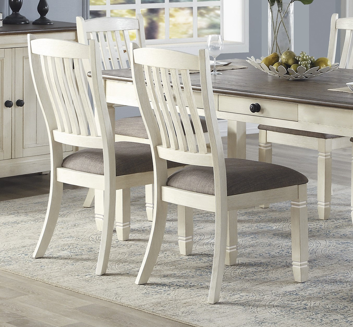 Pair of distressed white dining chairs with grey upholstered seats