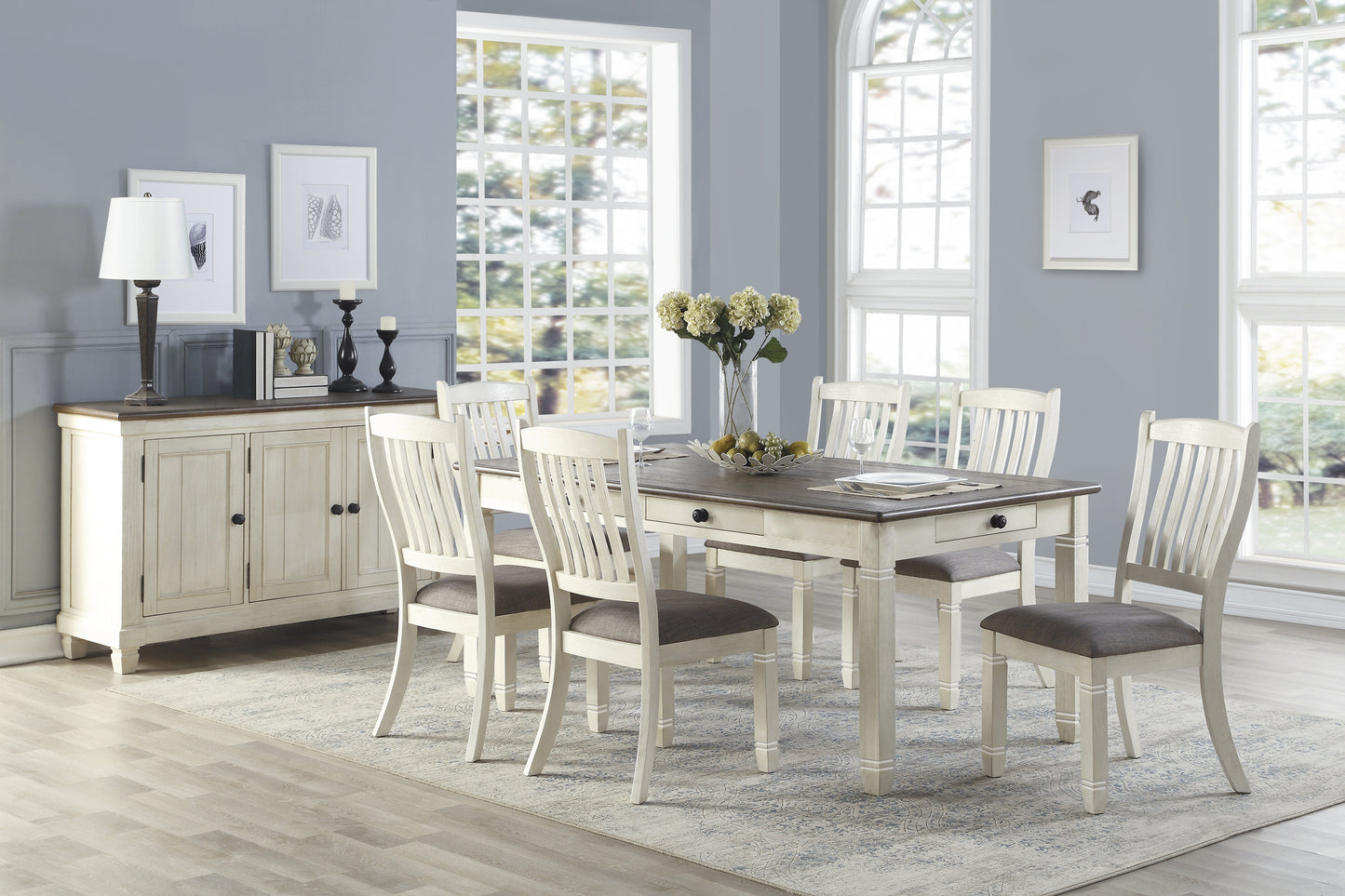 Rustic farmhouse dining table set with white chairs and dark wood top