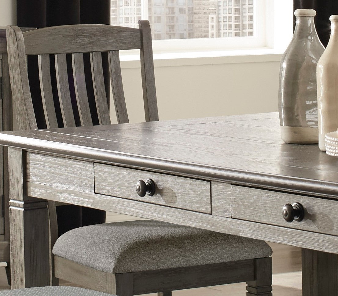 Rustic grey wood dining table with two drawers and antique black knobs