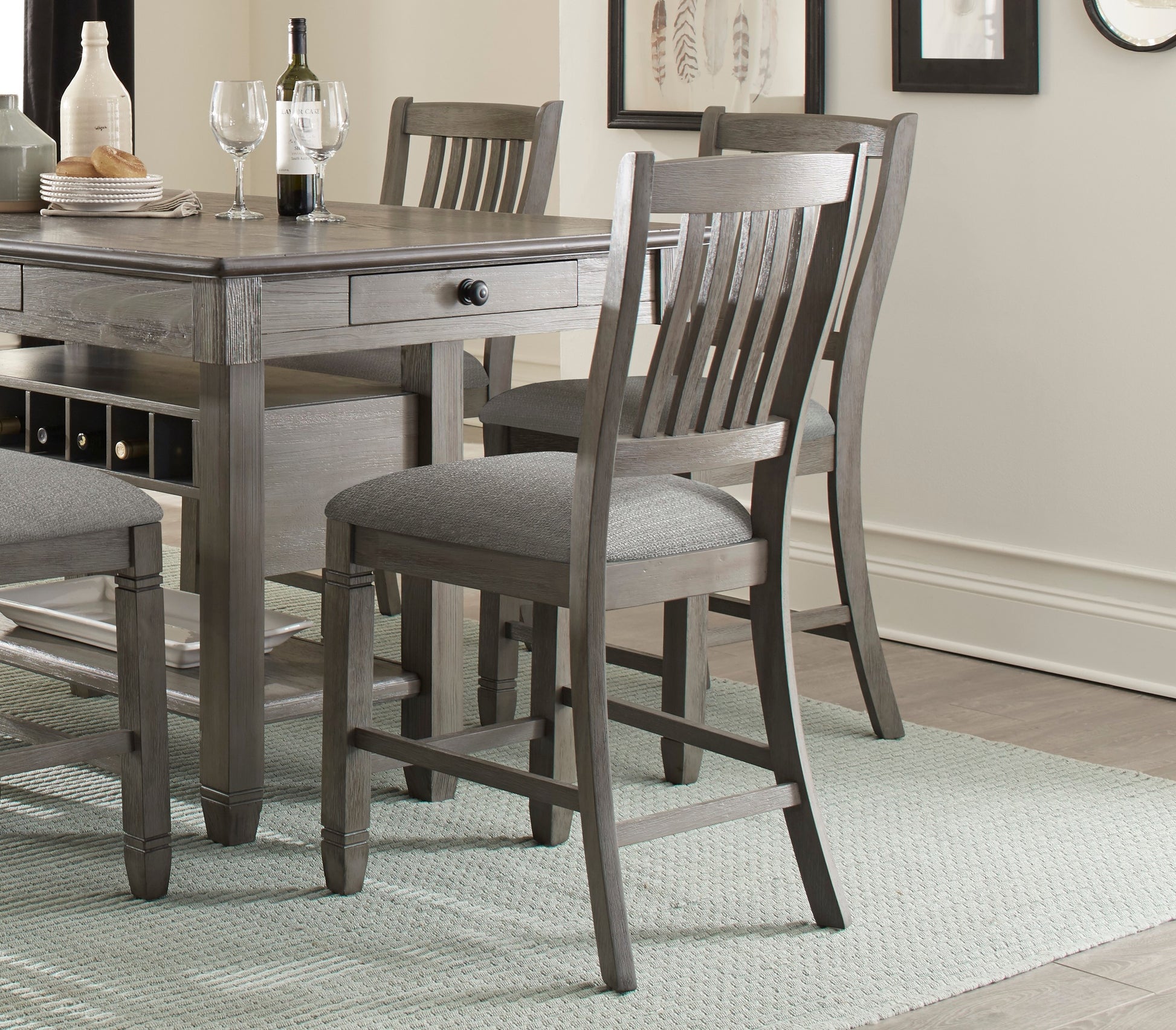 Gray wood dining set with cushioned stools and wine rack
