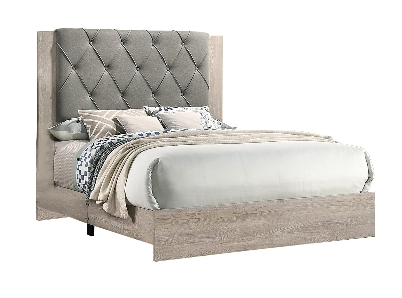 Tufted grey fabric headboard on a light wood frame bed with geometric pillows and neutral bedding
