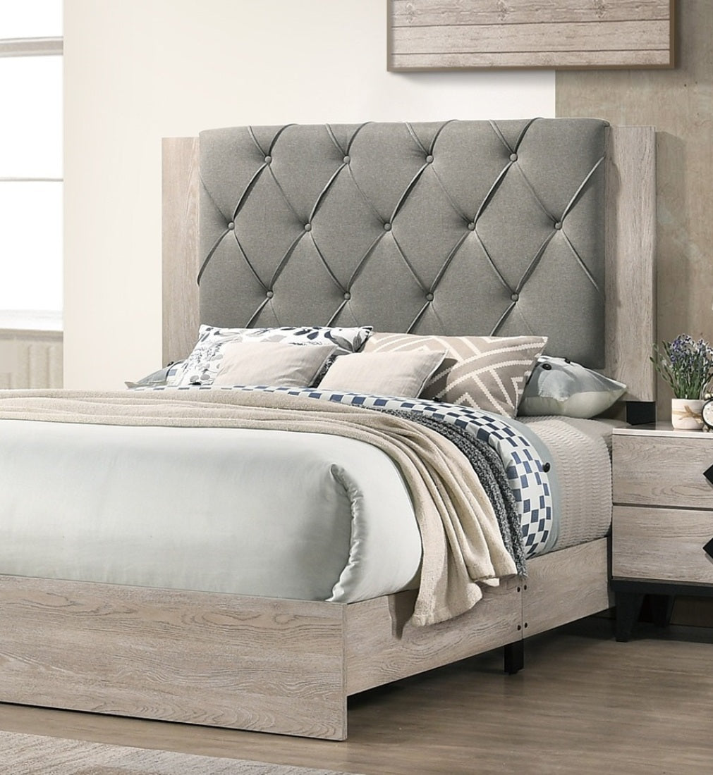 Tufted grey fabric king bed with light wood frame
