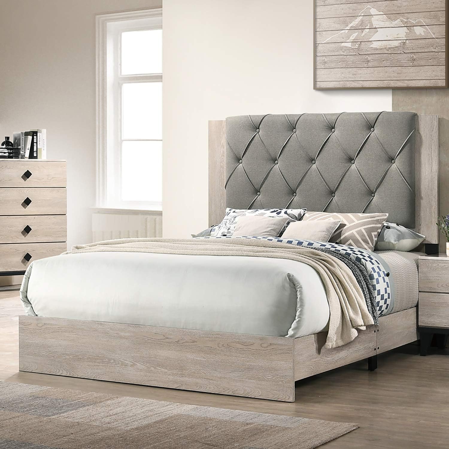 Tufted grey fabric headboard on a rustic woodfinish platform bed frame