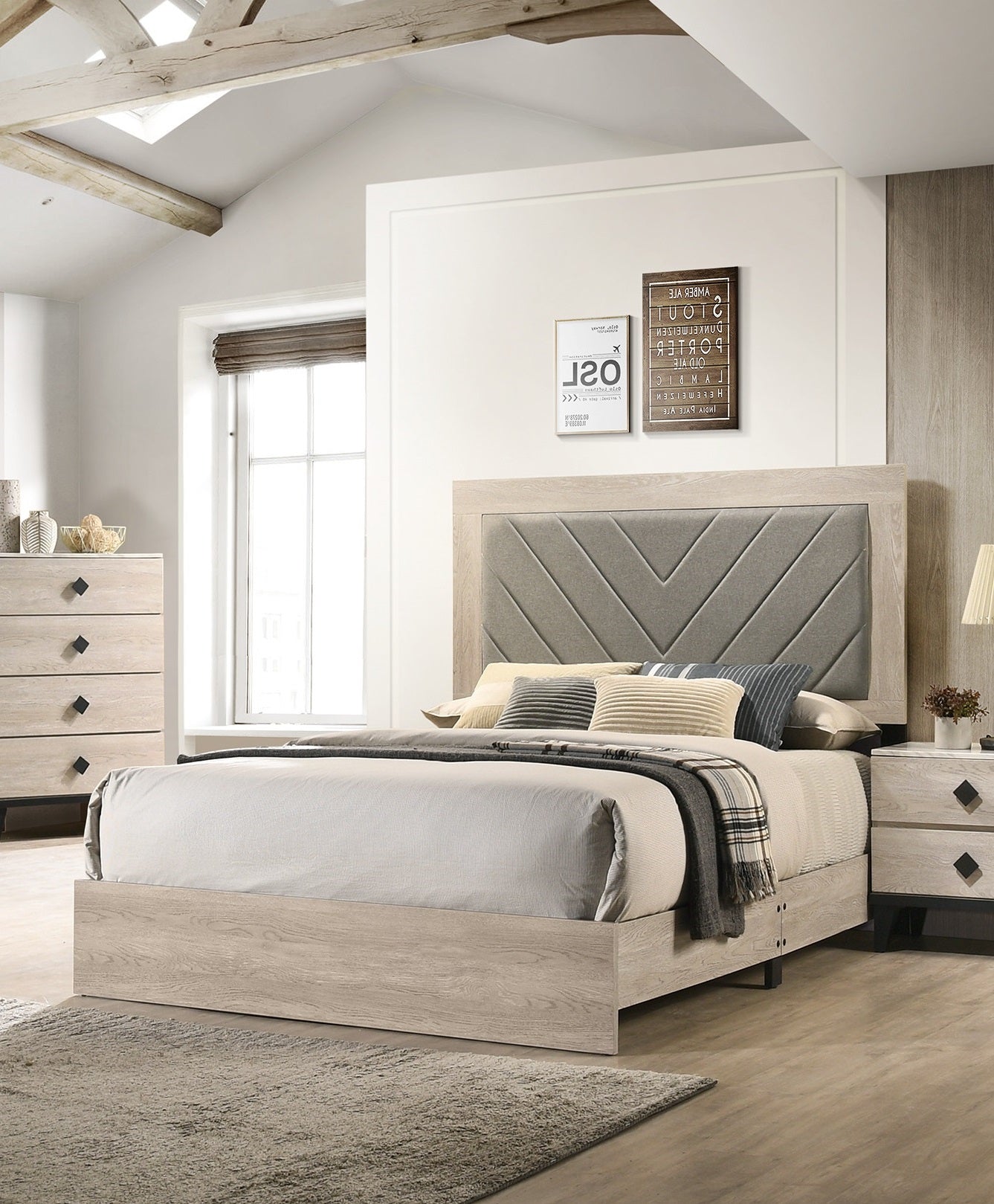 Light oak king bed with upholstered gray chevron headboard and white linens