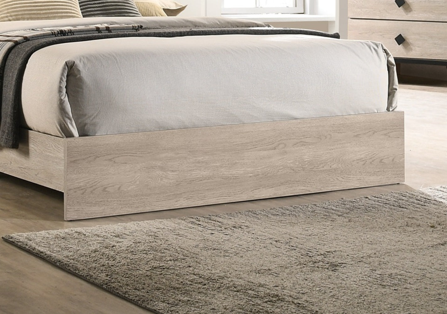 Modern light wood queen bed frame with textured grey rug