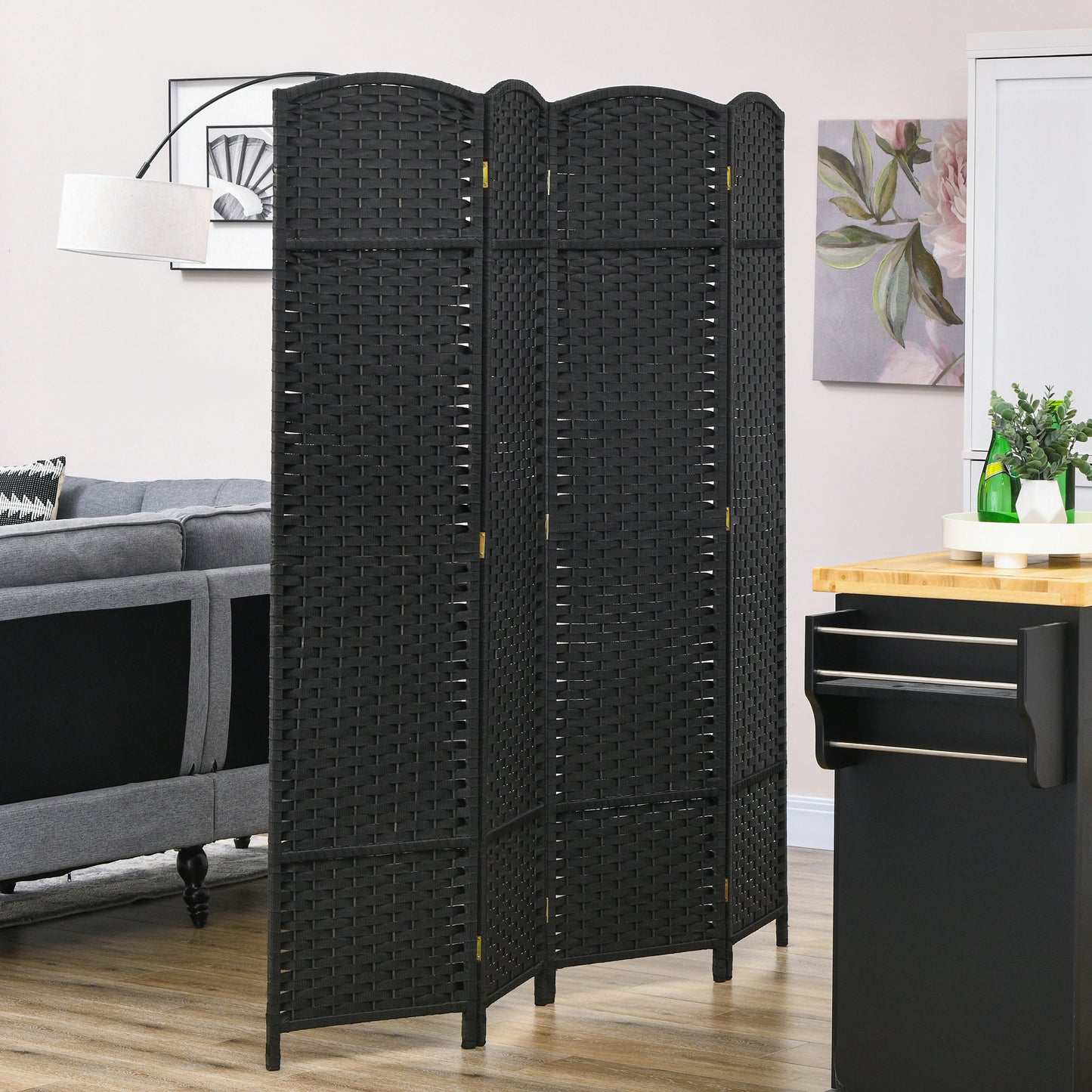 Black woven room divider with  panels offering privacy and room separation