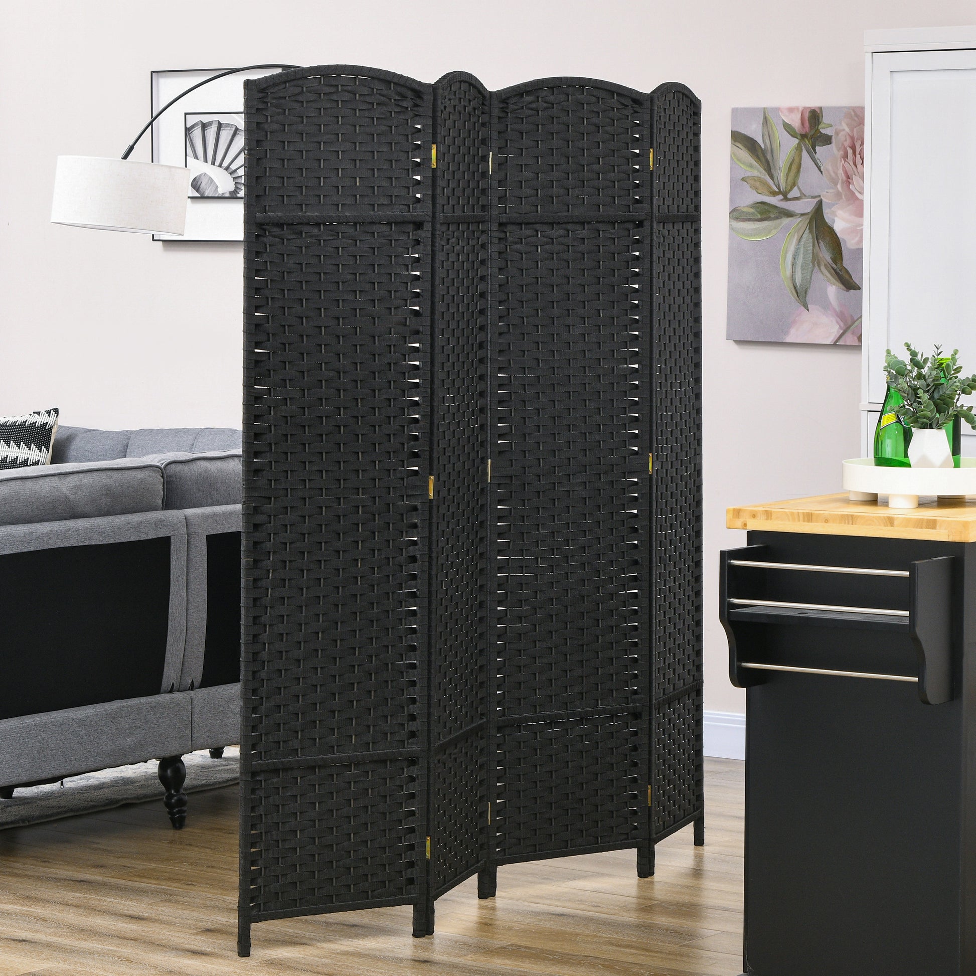Black woven room divider with  panels offering privacy and room separation