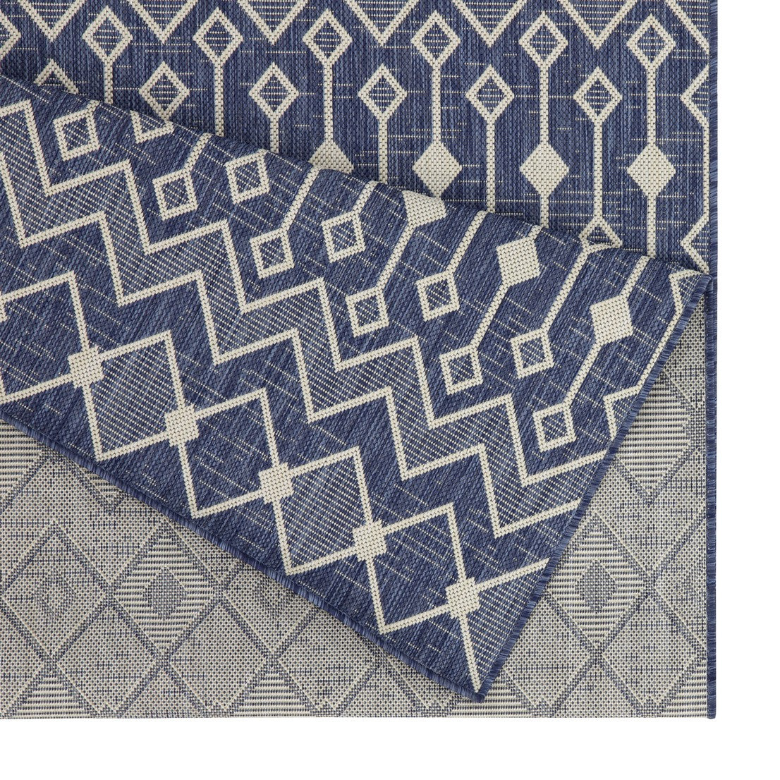 Navy and cream geometric outdoor rug with diamond and zigzag patterns