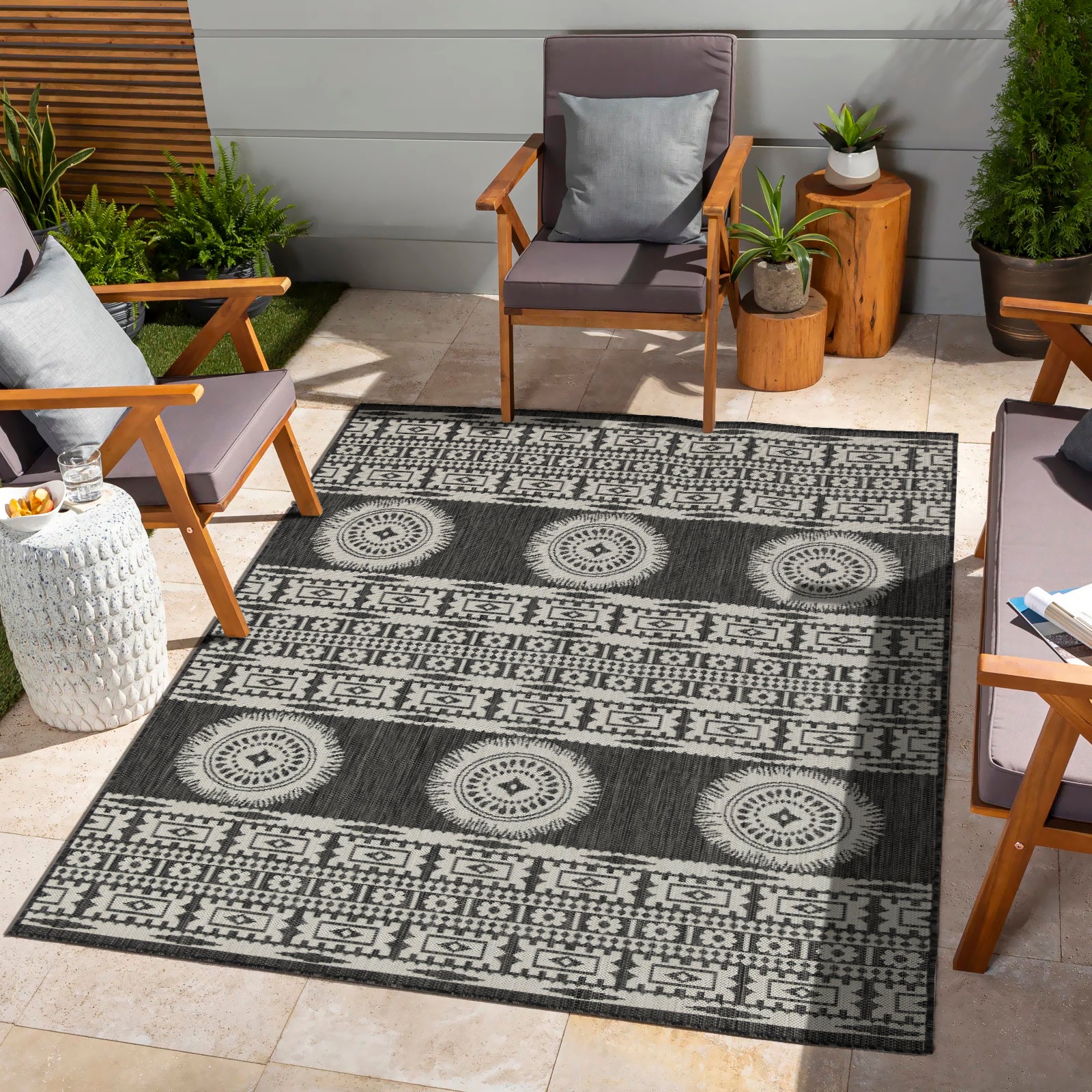 Dark gray outdoor rug with black and white tribal geometric pattern