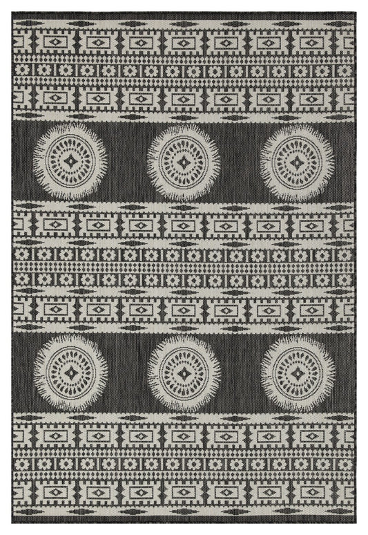 Black and white tribal pattern rug with circular motifs