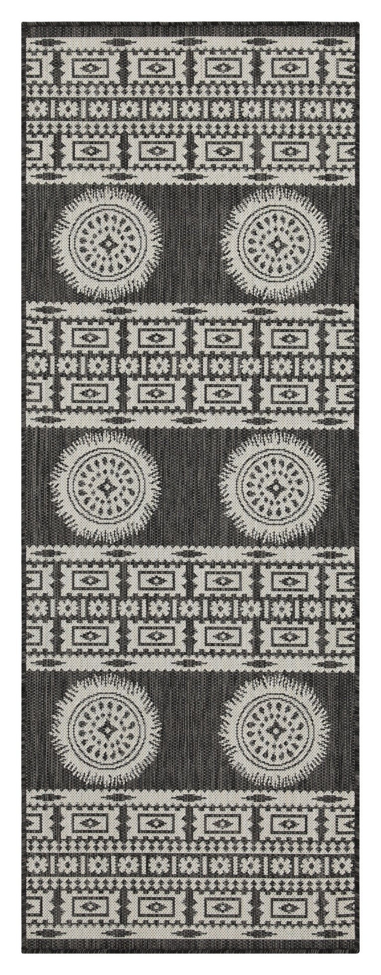 Black and white geometric patterned outdoor rug with circular motifs