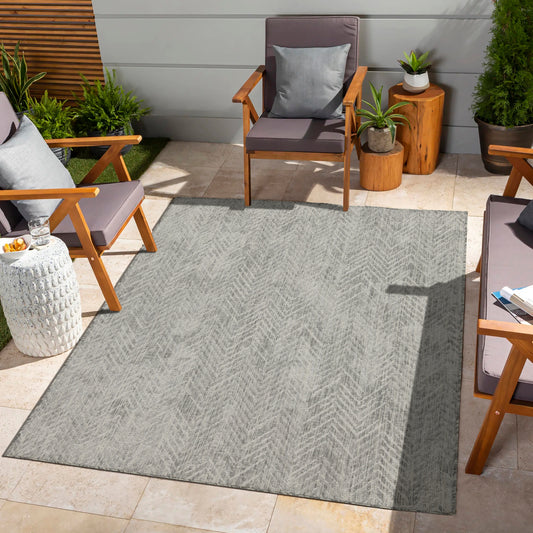 Gray herringbone patio rug with UVresistant weave for outdoor living spaces