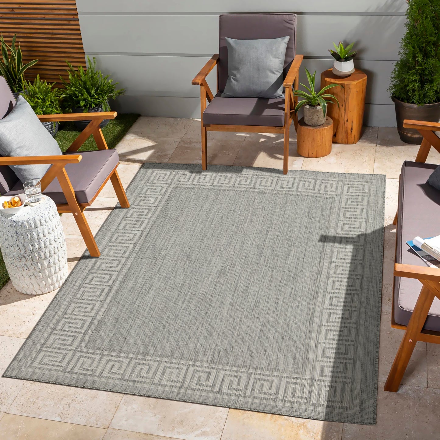 Grey outdoor rug with classic Greek key border perfect for patio decor