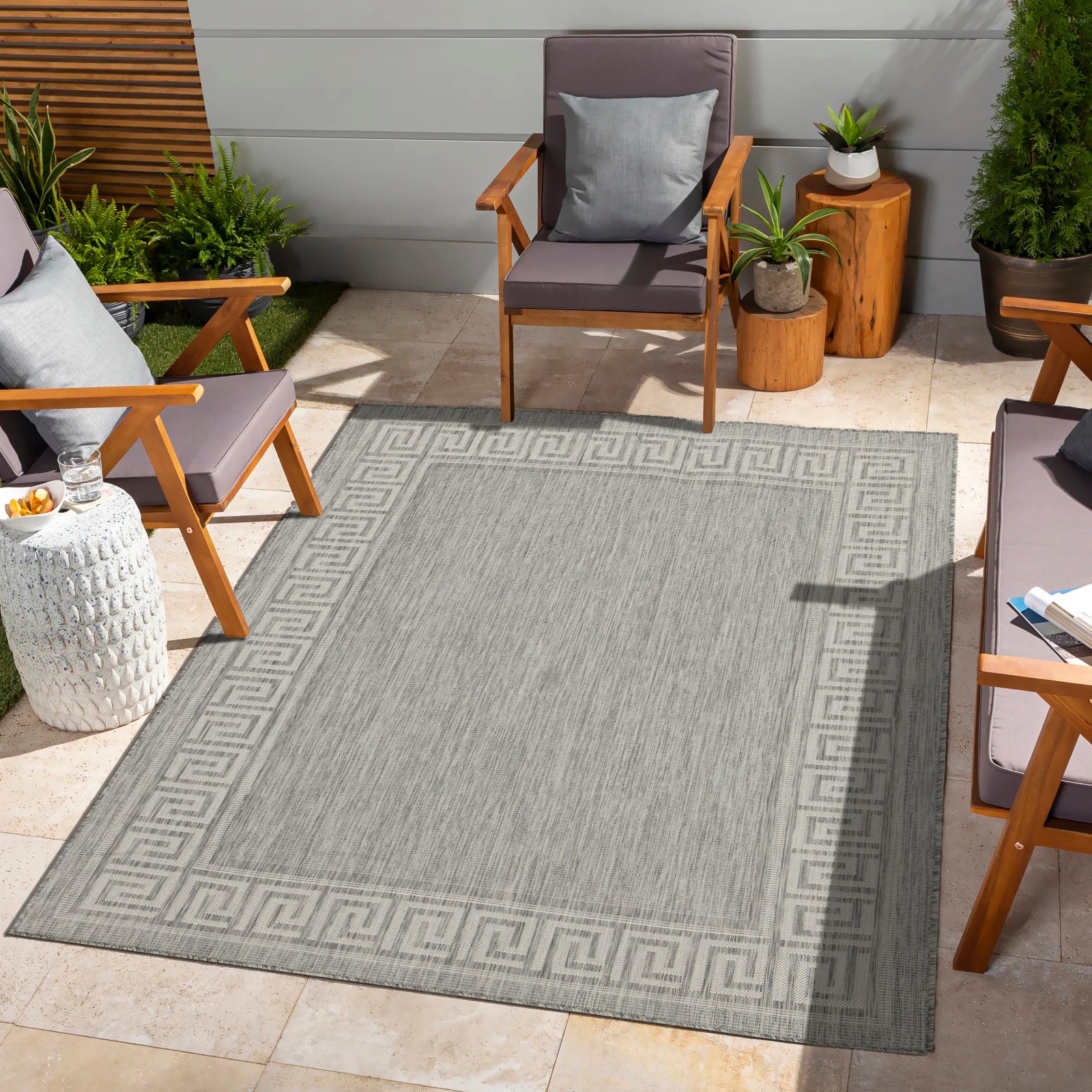 Grey outdoor rug with classic Greek key border perfect for patio decor