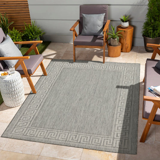 Grey outdoor rug with classic Greek key border perfect for patio decor