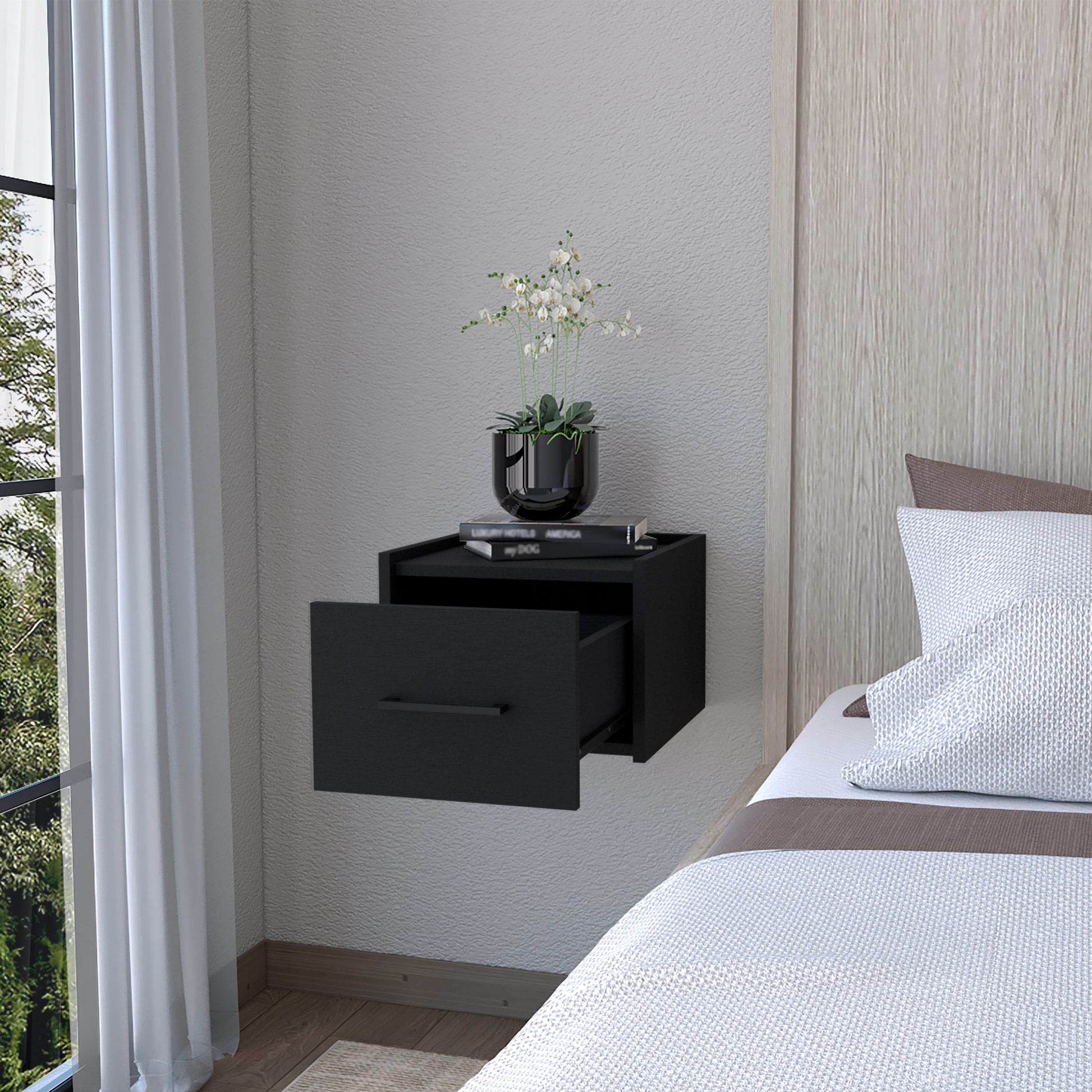 Modern black wallmounted nightstand with a single open drawer and minimalist handle