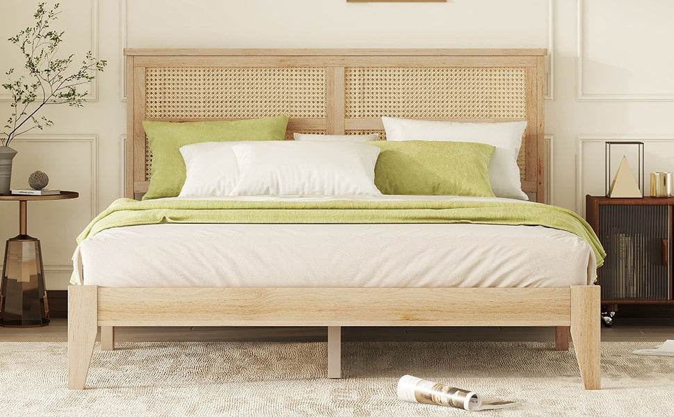 Light wood platform bed with woven cane headboard and green accents